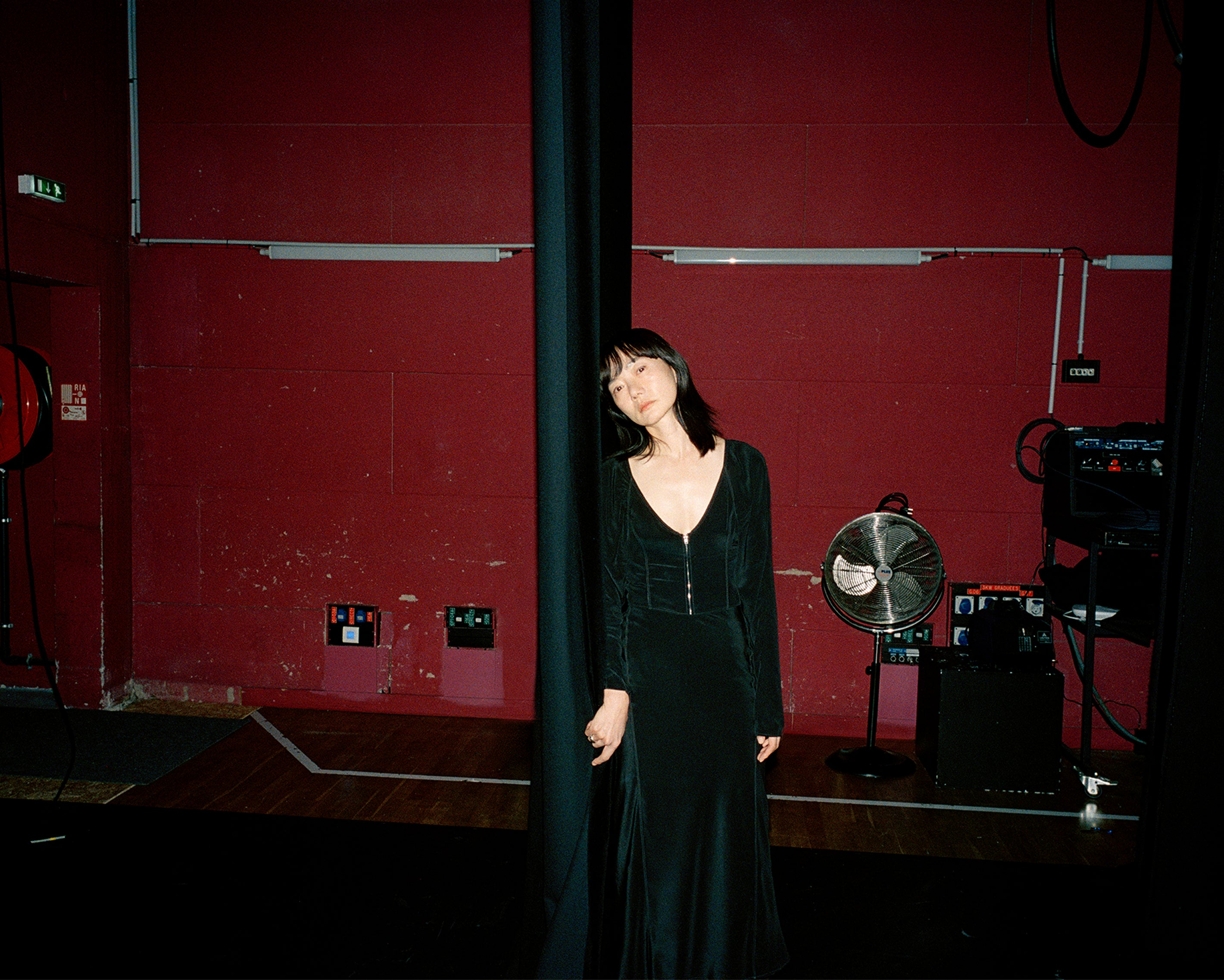 Black dress in Black fabric, model shot, Front view Long sleeve, fitted