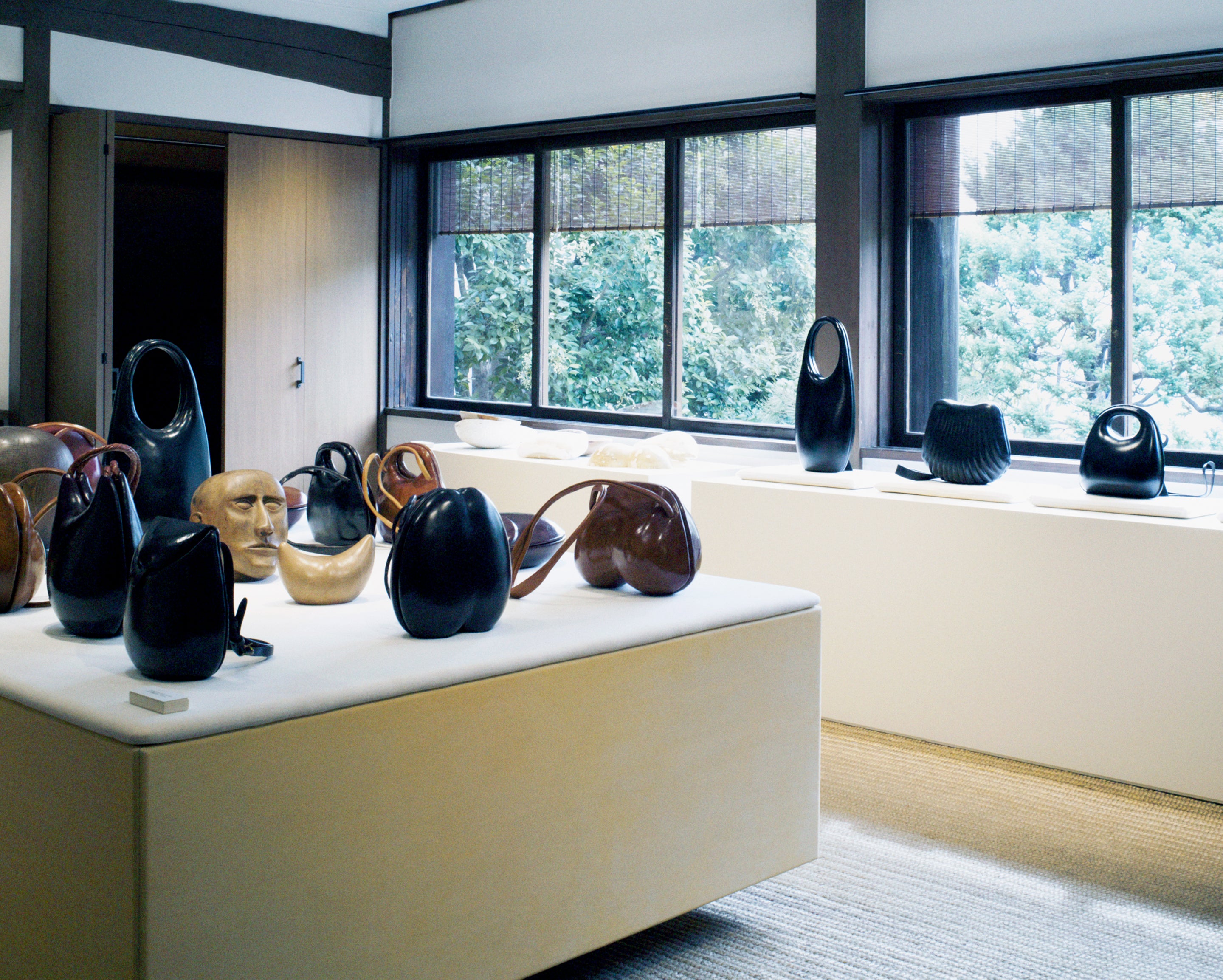 Decorative sculptural objects in Black and brown glossy ceramic, Front view Abstract organic shapes