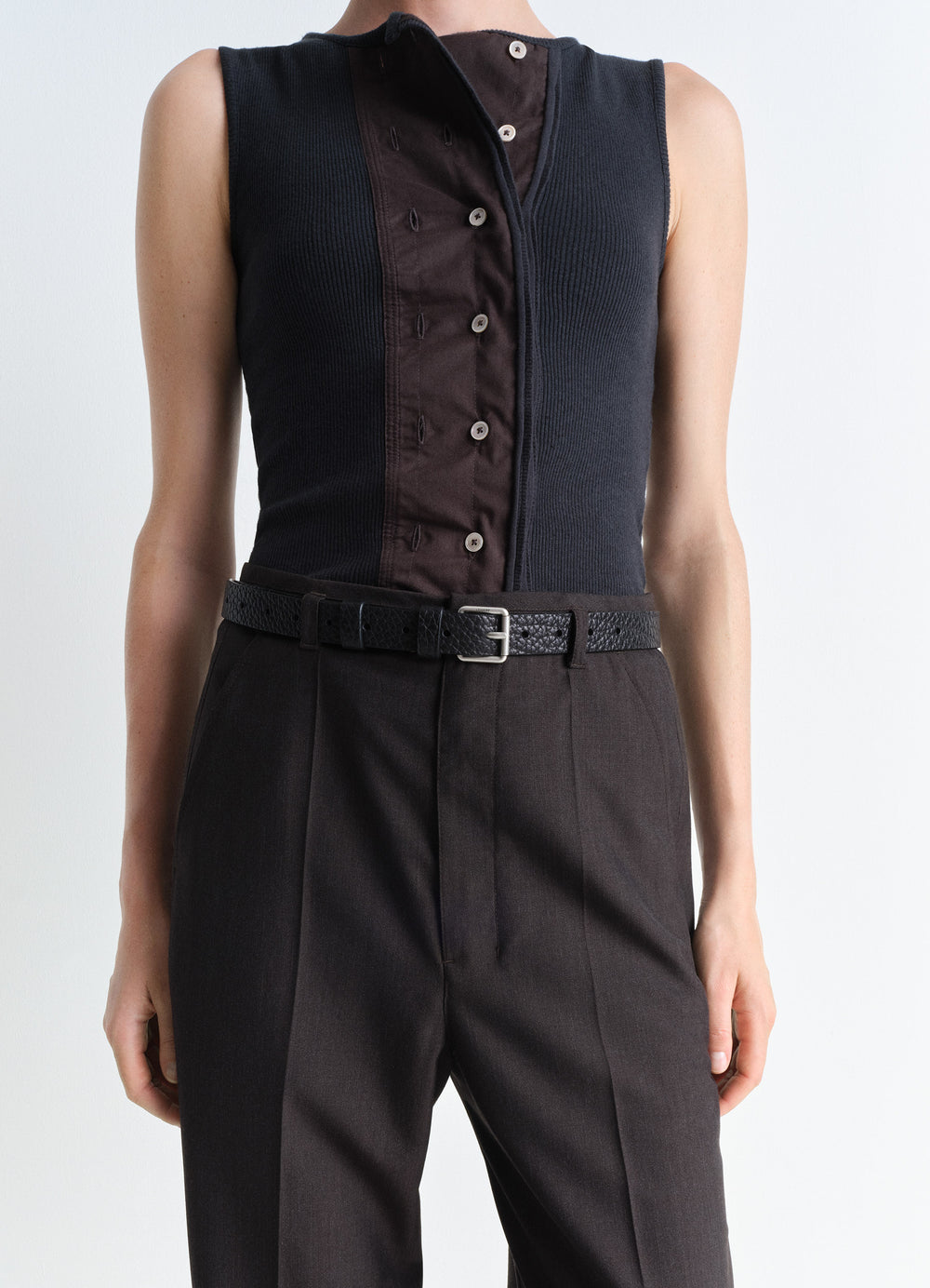 Lemaire Reversed Belt 25 in Black Vegetable-Tanned Leather, model shot, waist close-up textured leather grain