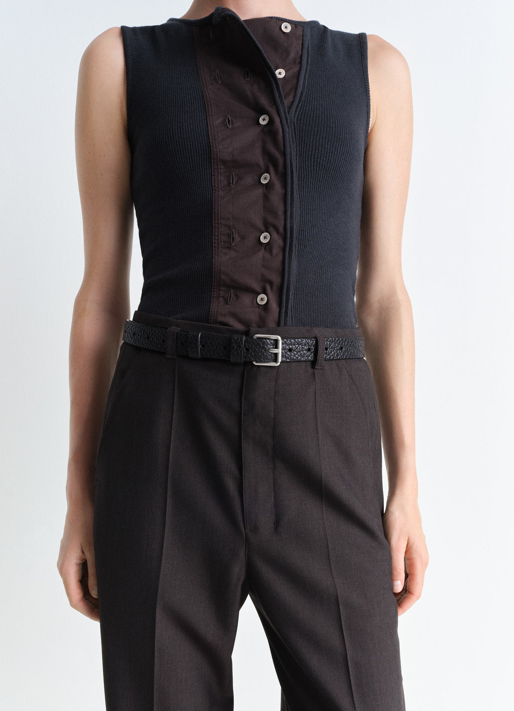 Lemaire Reversed Belt 25 in Black Vegetable-Tanned Leather, model shot, waist close-up textured leather grain