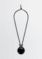 Lemaire Necklace with Castanets in Black, product shot, Front view Simple cord design
