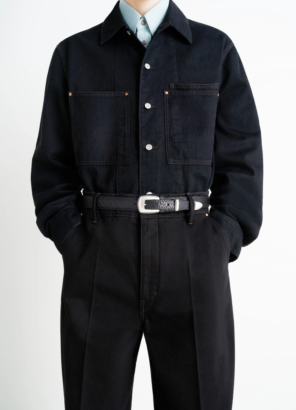 Minimal Western Belt in Grained Leather, model shot, waist-level view textured buckle design