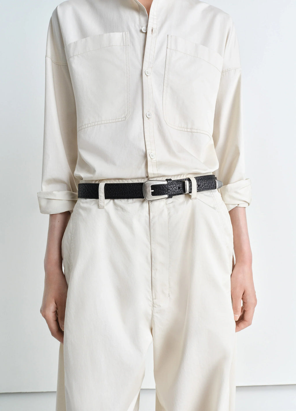 Minimal Western Belt in Grained Leather, model shot, front waist detail silver buckle close-up