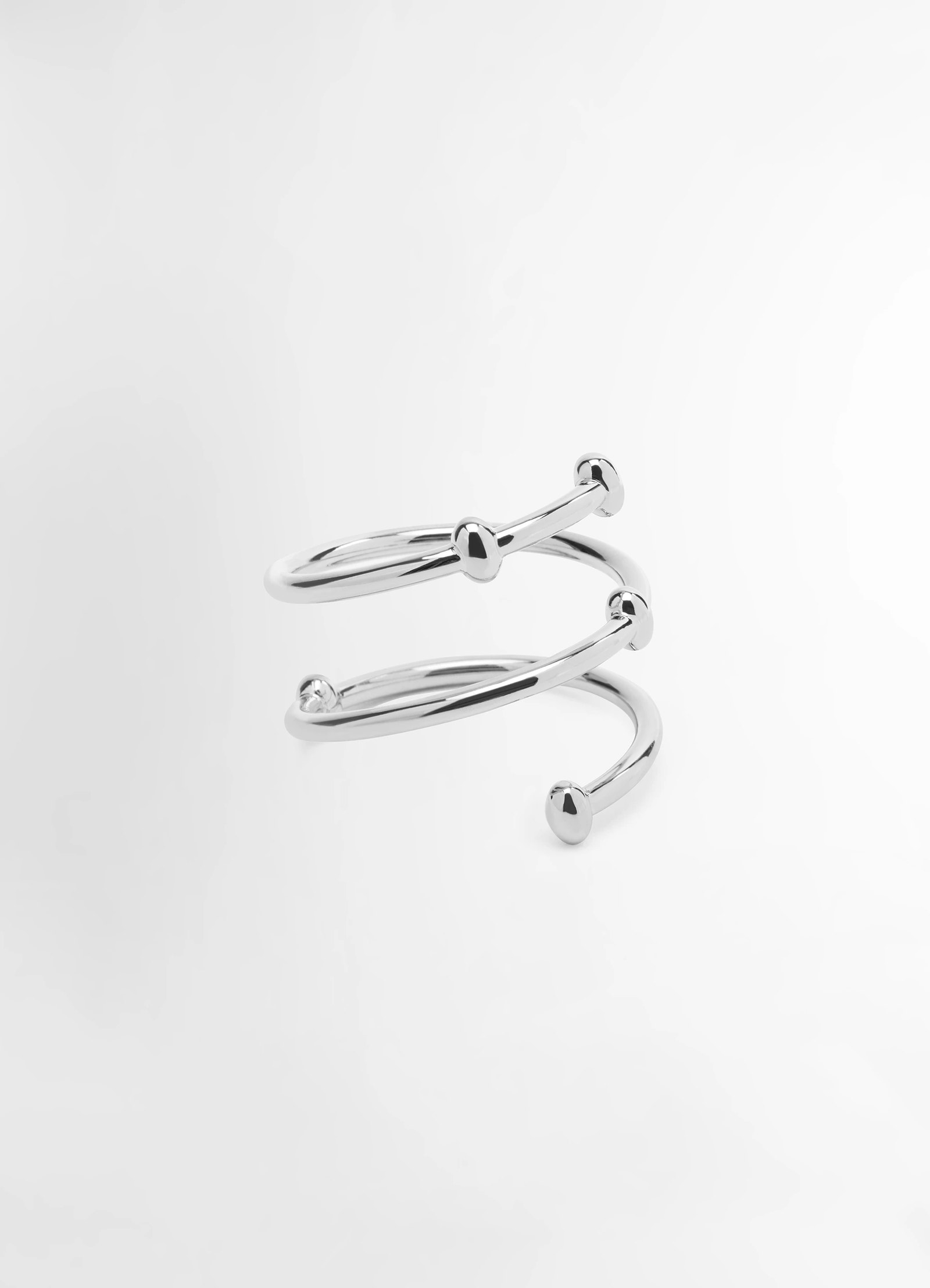 Lemaire croissant spiral jewelry in silver brass, product shot, side view irregular beads visible