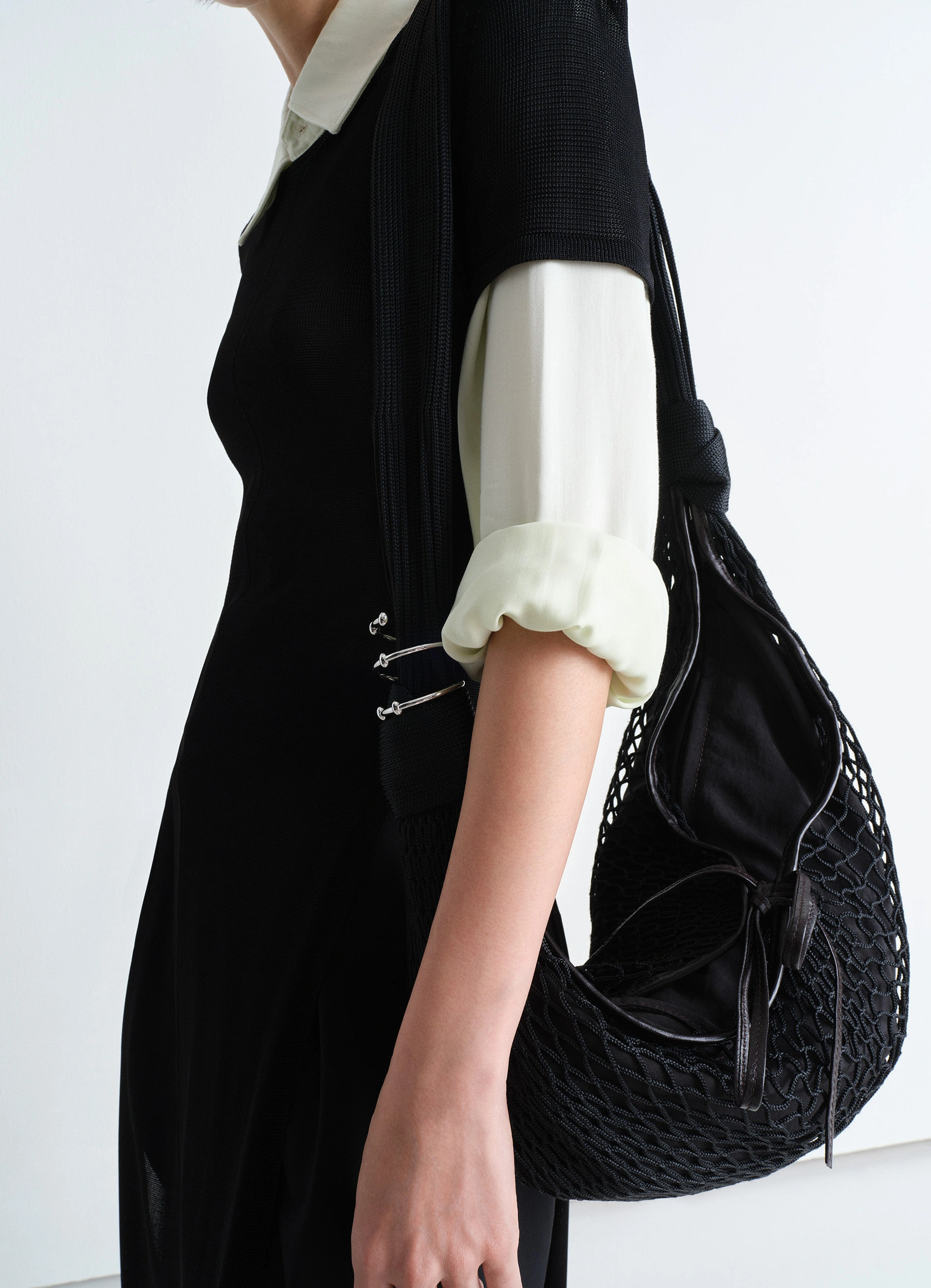 Lemaire croissant spiral jewelry in silver brass, model shot, detail shot worn on wrist