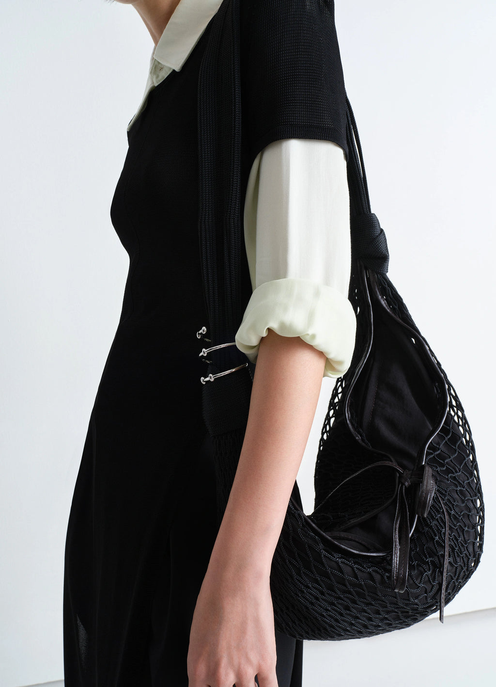 Lemaire Croissant Spiral Jewelry in Silver Brass, model shot, detail shot worn on wrist