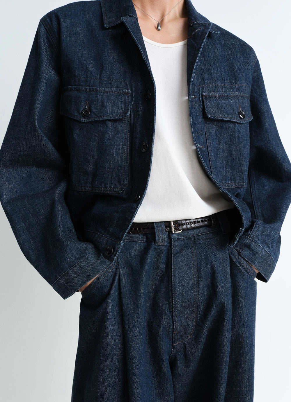 Lemaire Braided Belt 20 in Smooth vegetable-tanned leather, model shot, waist level close-up belt loops detail