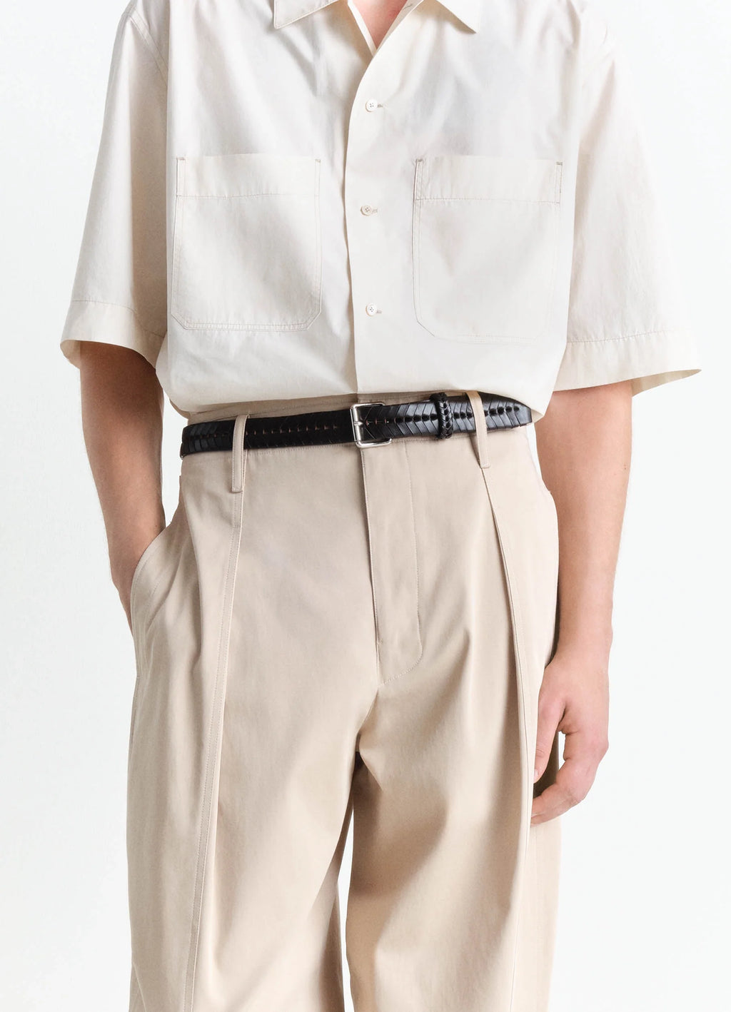 Lemaire braided belt 30 in smooth vegetable-tanned leather, model shot, front view worn with beige trousers