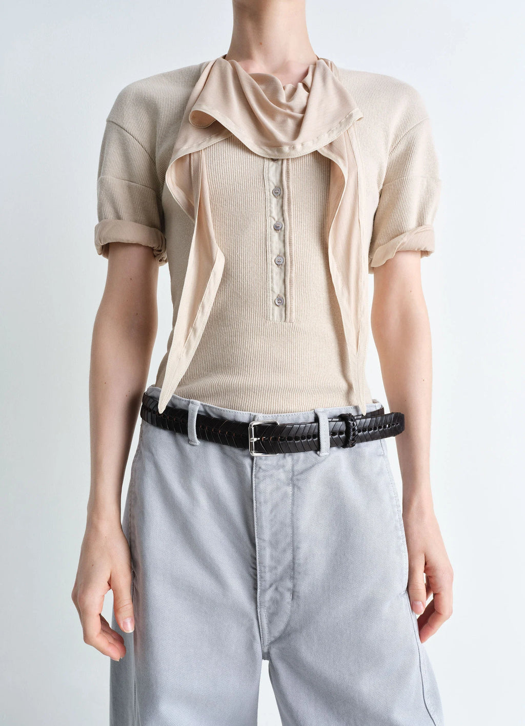 Lemaire braided belt 30 in smooth vegetable-tanned leather, model shot, waist-level view worn over light grey pants