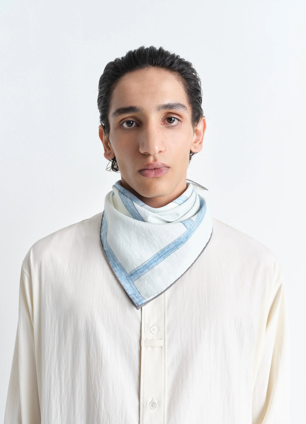 Philippe Weisbecker Silk Square in Silk Blue Chair Print, model shot, detail close-up styled as neckerchief