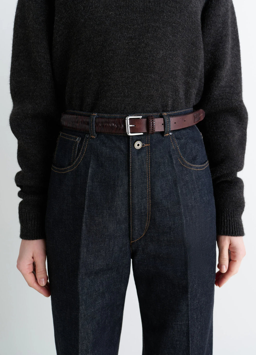 Weaved Belt 25 in Shiny Braided Leather, model shot, waist level detail silver buckle accent