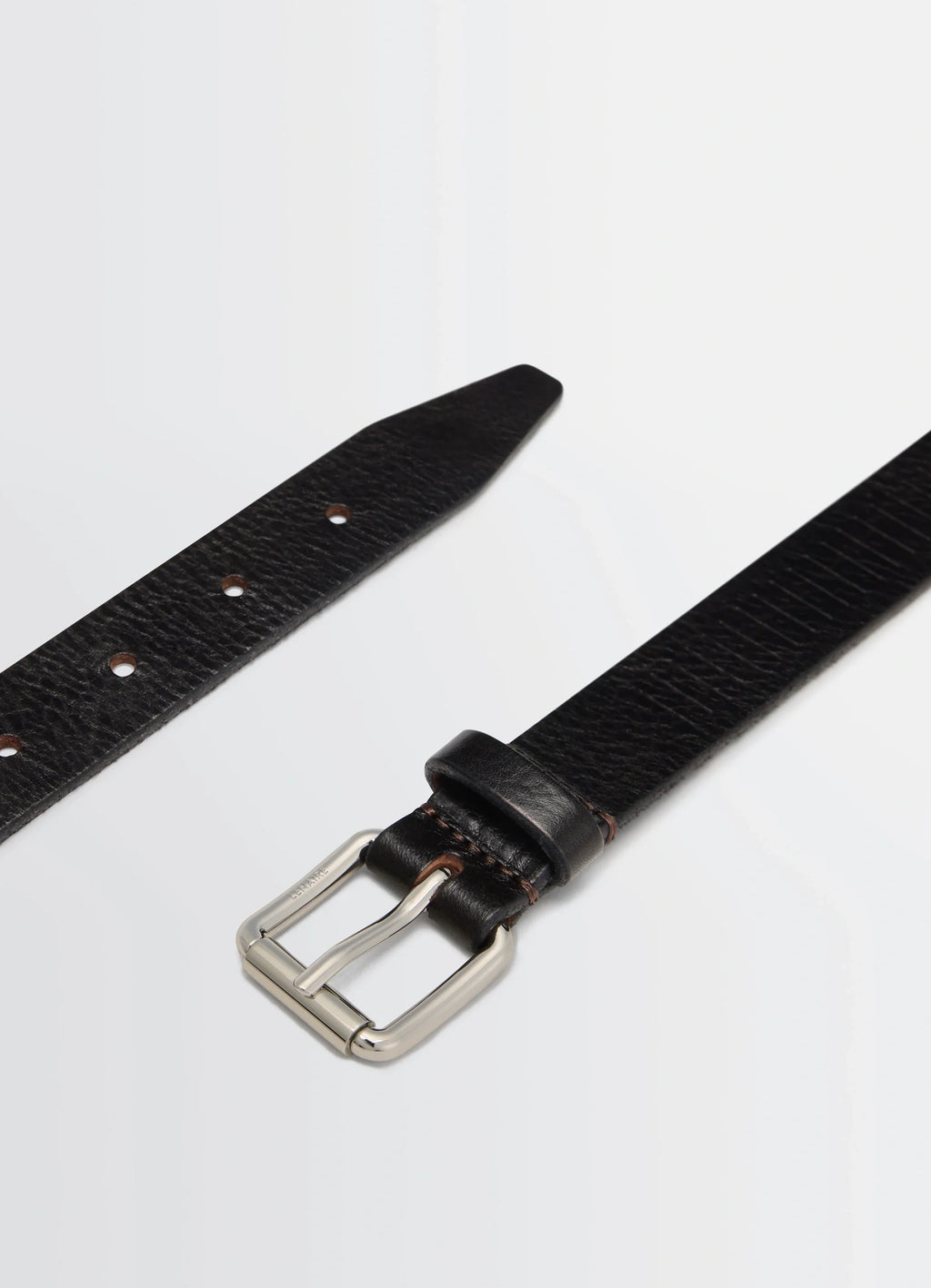 Rail Belt 25 in rail-embossed leather, product shot, angled detail shot pointed tip, textured finish