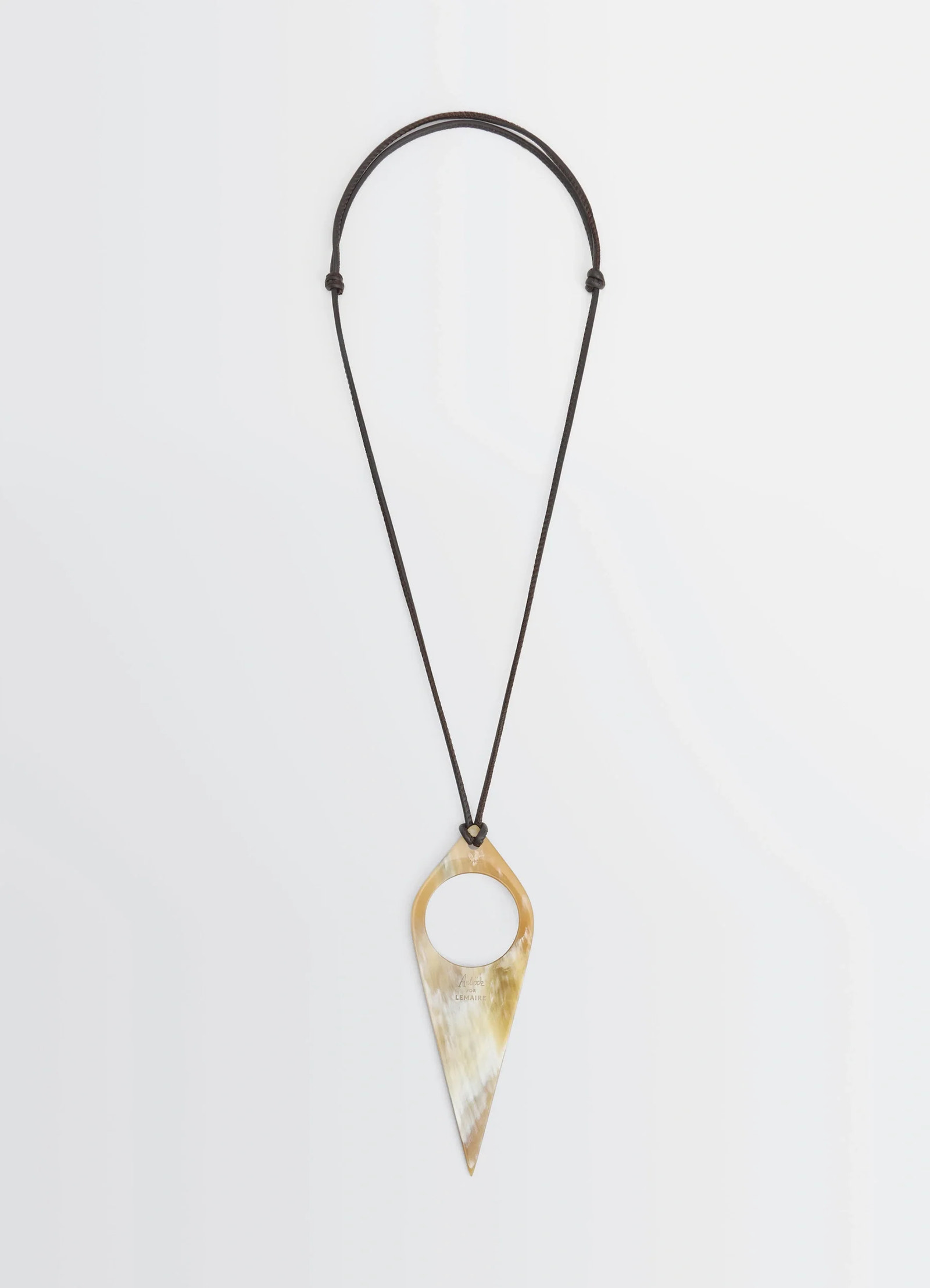 Aubock magnifying glass necklace in horn, product shot, front view unique horn pattern