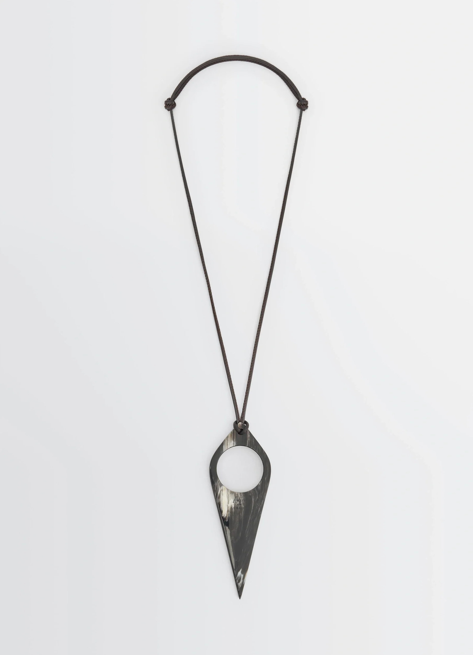 Aubock magnifying glass necklace in horn, product shot, front view unique horn pattern