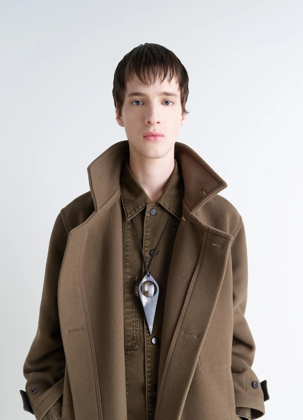 AUBOCK Magnifying Glass Necklace in Horn, model shot, worn by model layered overcoat style