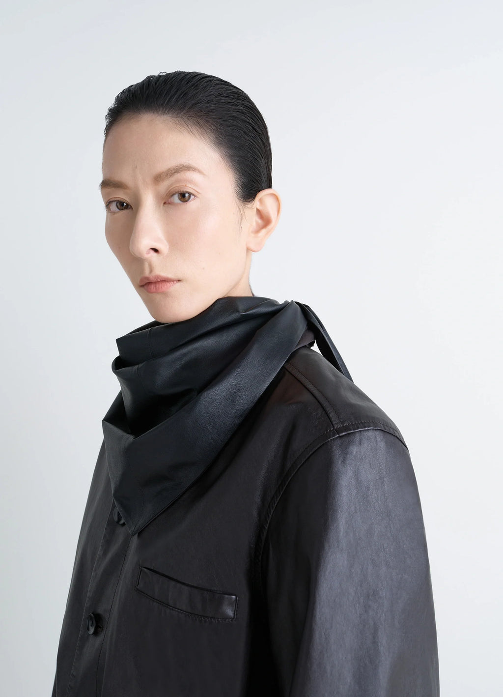 Leather Triangle Scarf in Black Nappa Lamb Leather, model shot, close-up scarf draped on neck
