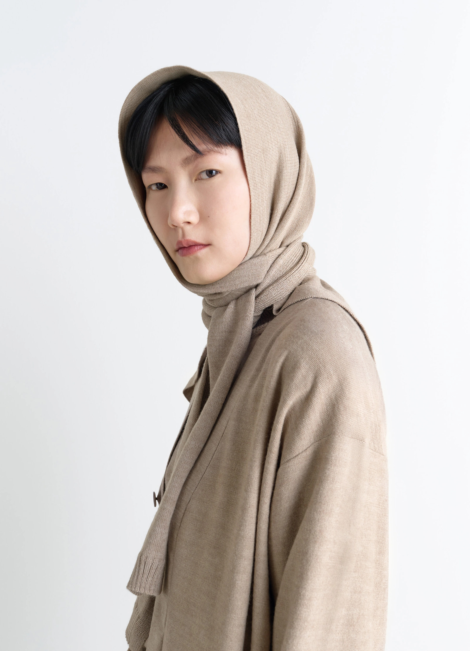 Trompe loeil scarf in beige blended merino wool, model shot, side view layered appearance