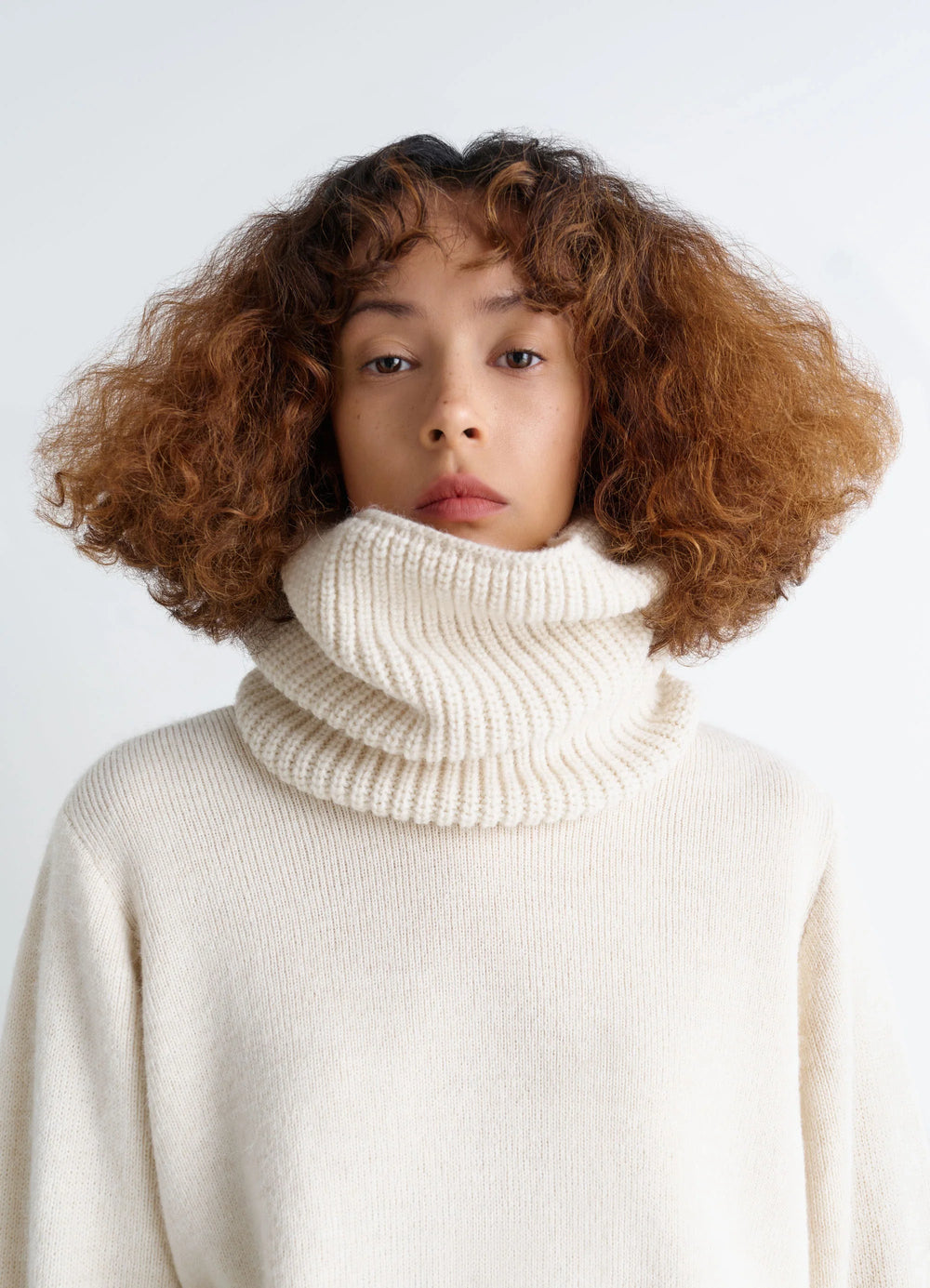 Ribbed Wool Alpaca Snood in Cream Wool Alpaca Blend, model shot, Front view Ribbed knit texture