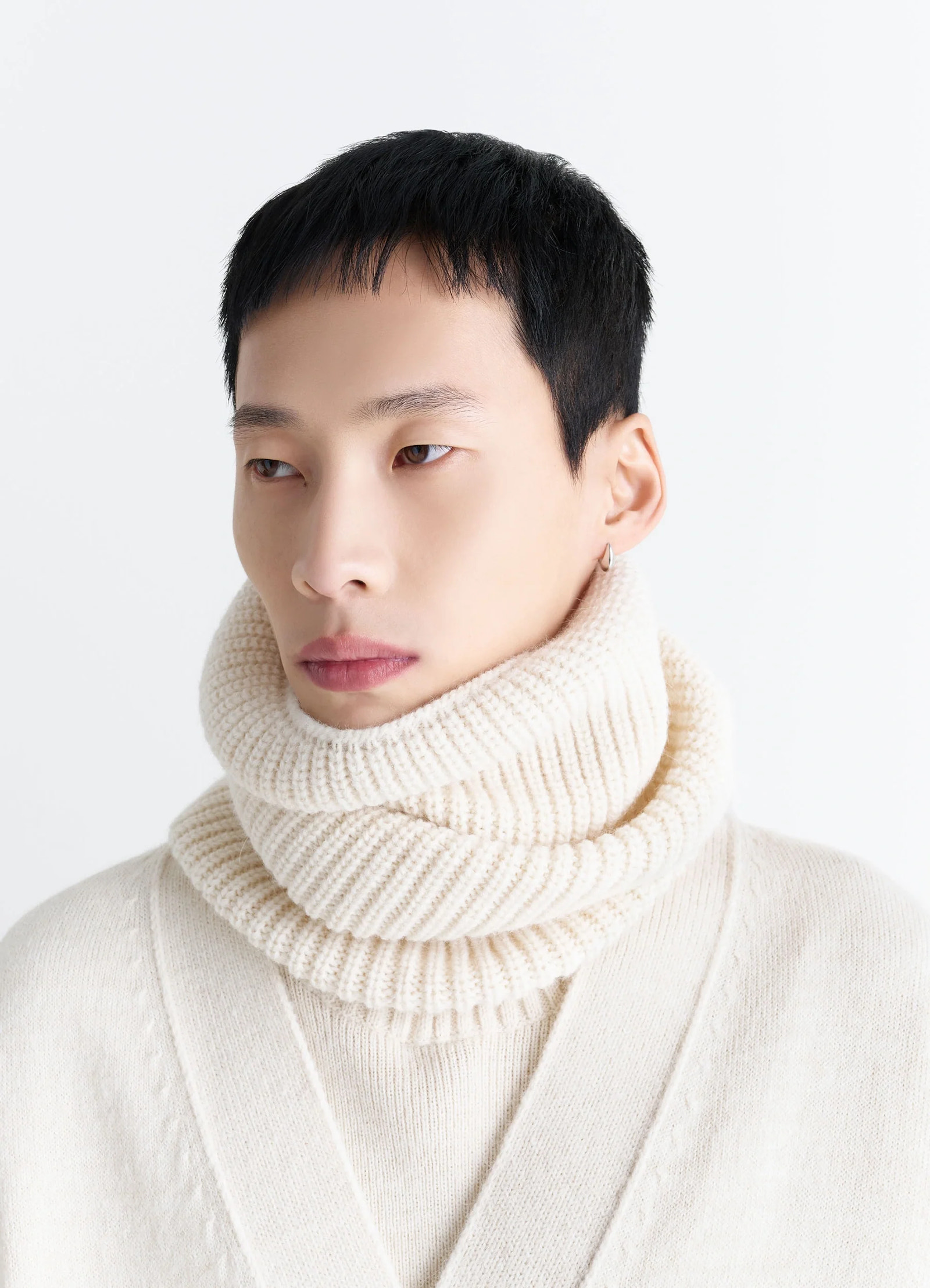 Ribbed wool alpaca snood in cream wool alpaca blend, model shot, close-up side view draped styling context