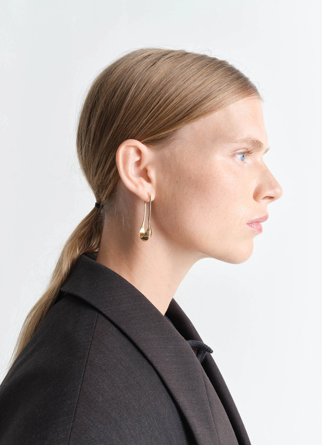 Lemaire Short Drop Earrings in Vermeil, model shot, side view minimalist profile