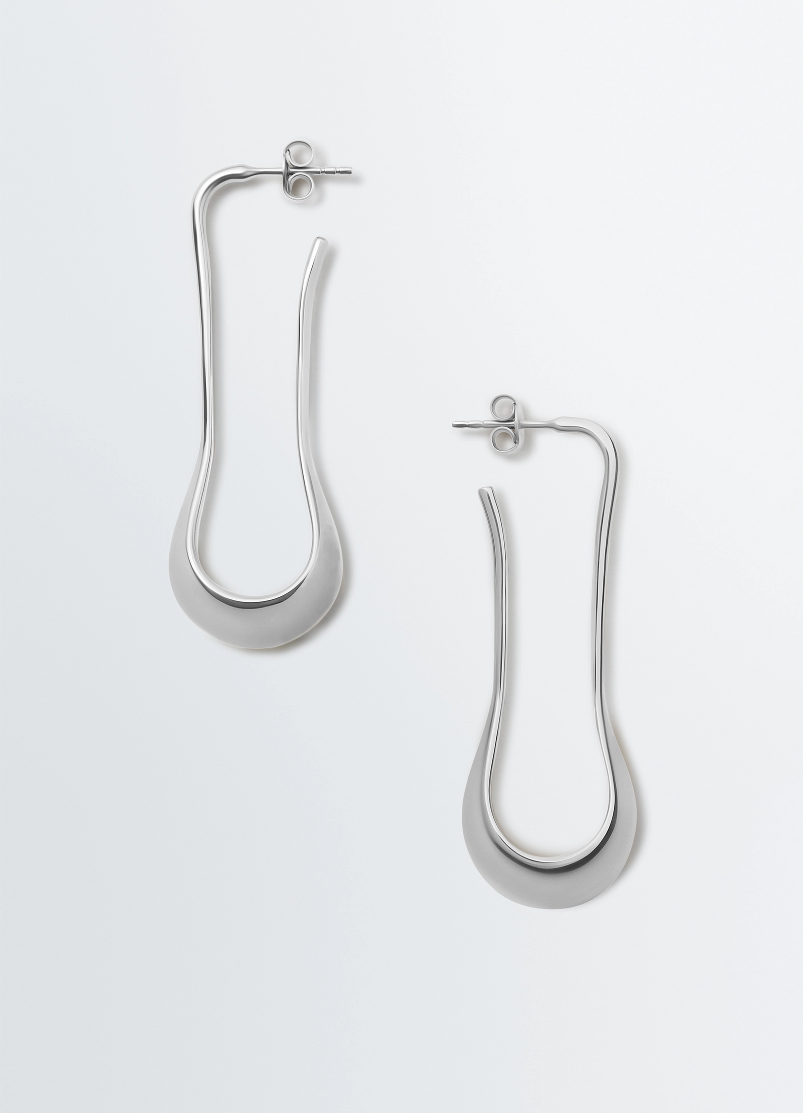 Lemaire short drop earrings in rhodium-plated silver, product shot, top view signature drop design