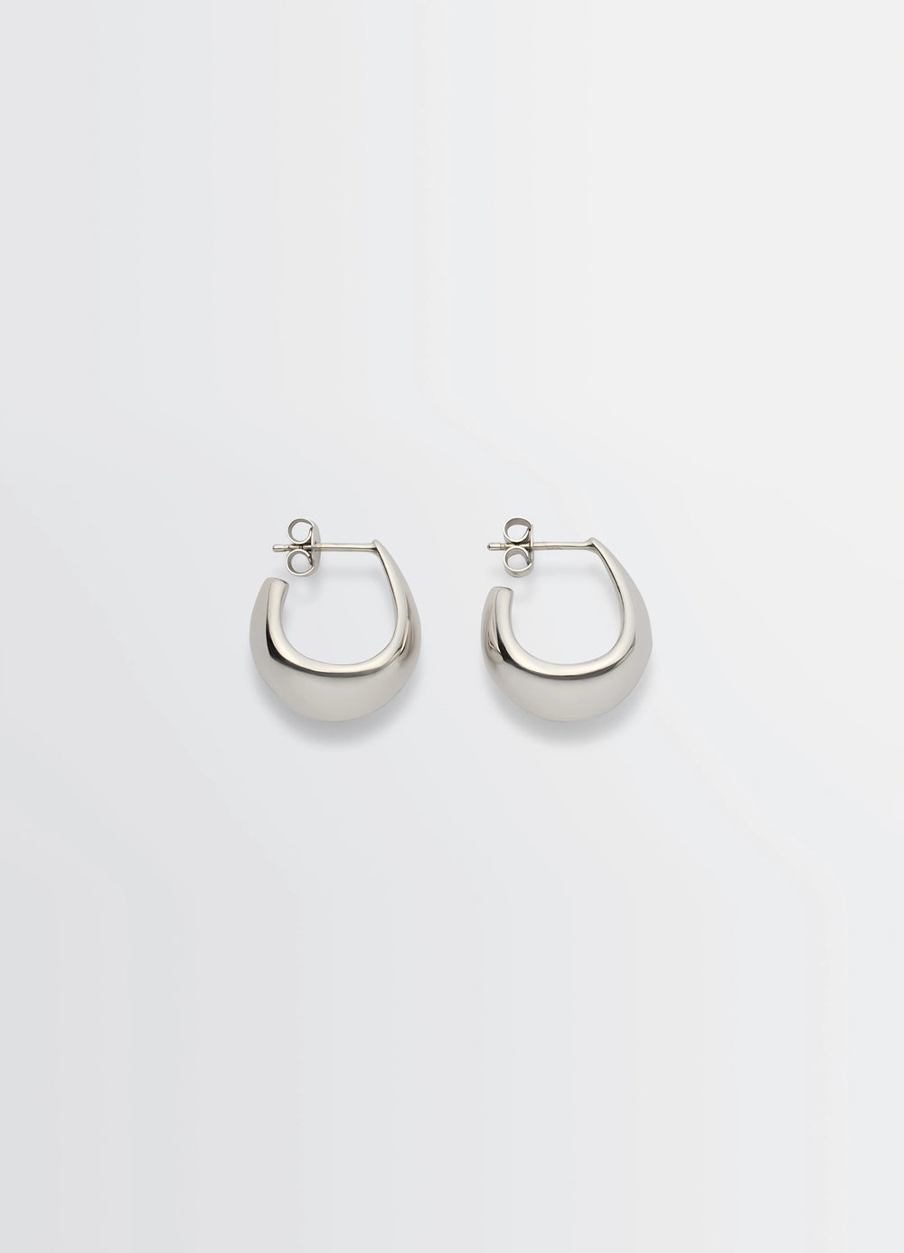 Lemaire Curved Mini Drop Earrings in Rhodium-Plated Silver, product shot, Front View Curved Drop-Shaped Design
