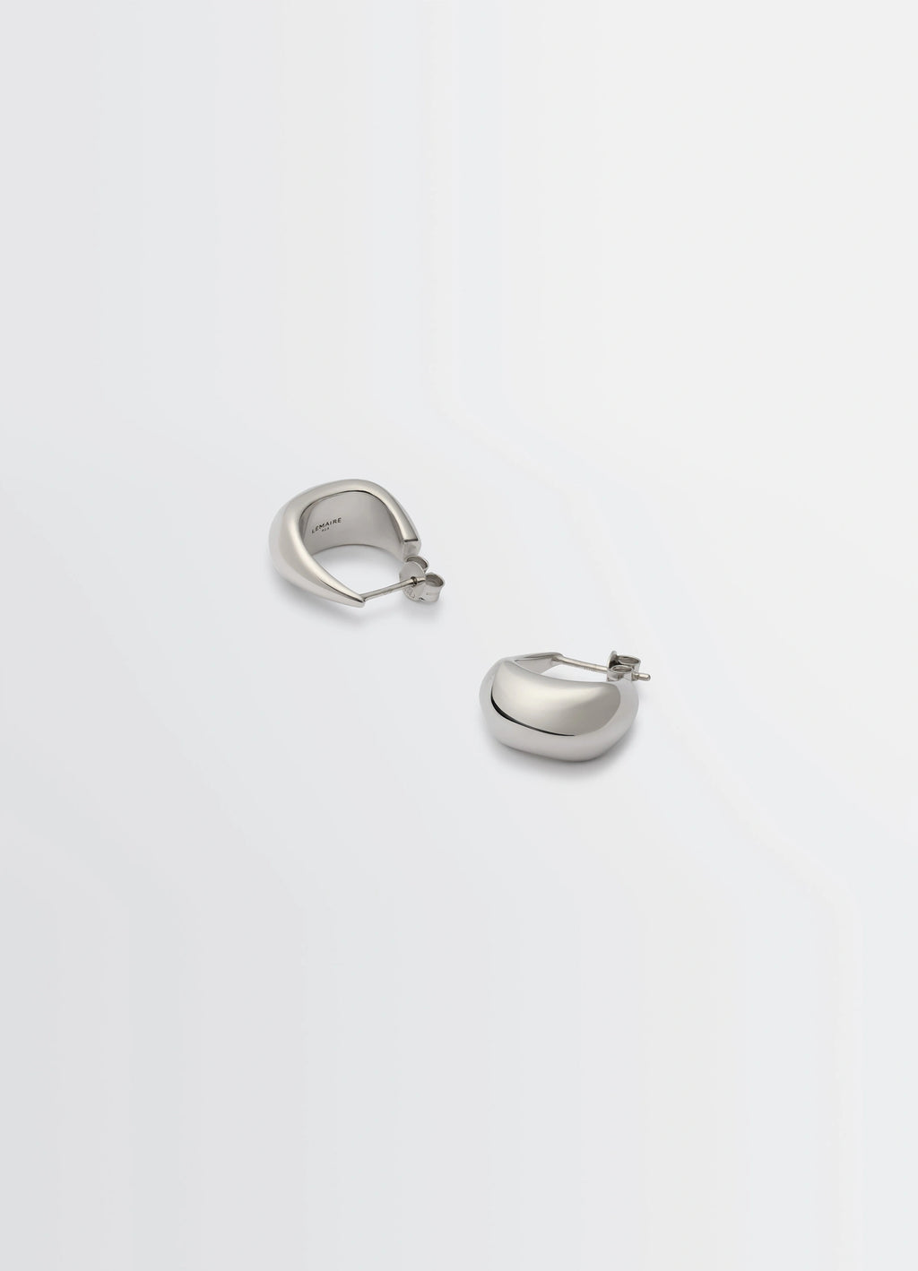 Lemaire Curved Mini Drop Earrings in Rhodium-Plated Silver, product shot, top angle curved drop shape