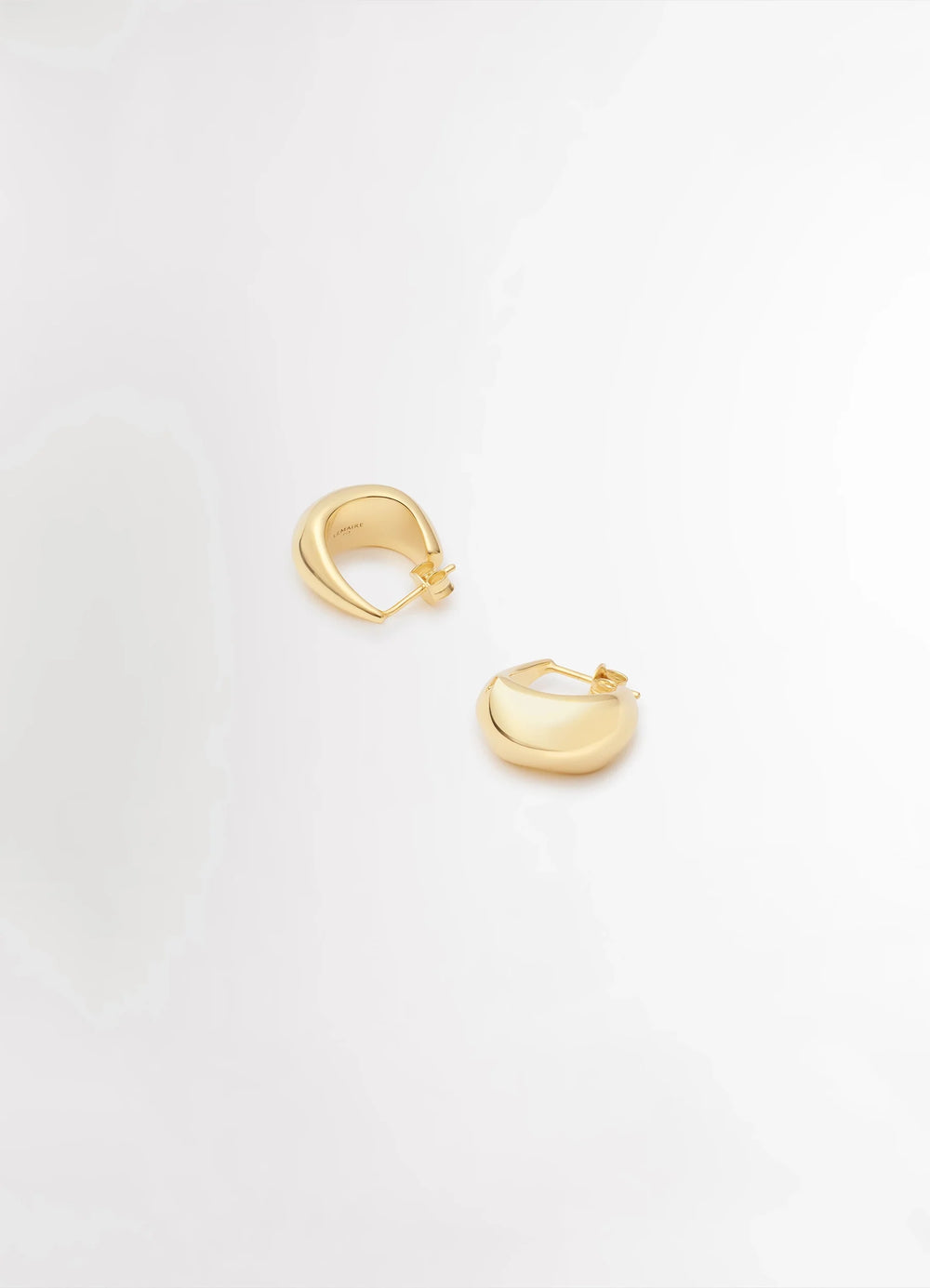 Lemaire Curved Mini Drop Earrings in Gold Vermeil, product shot, top angled view smooth reflective finish