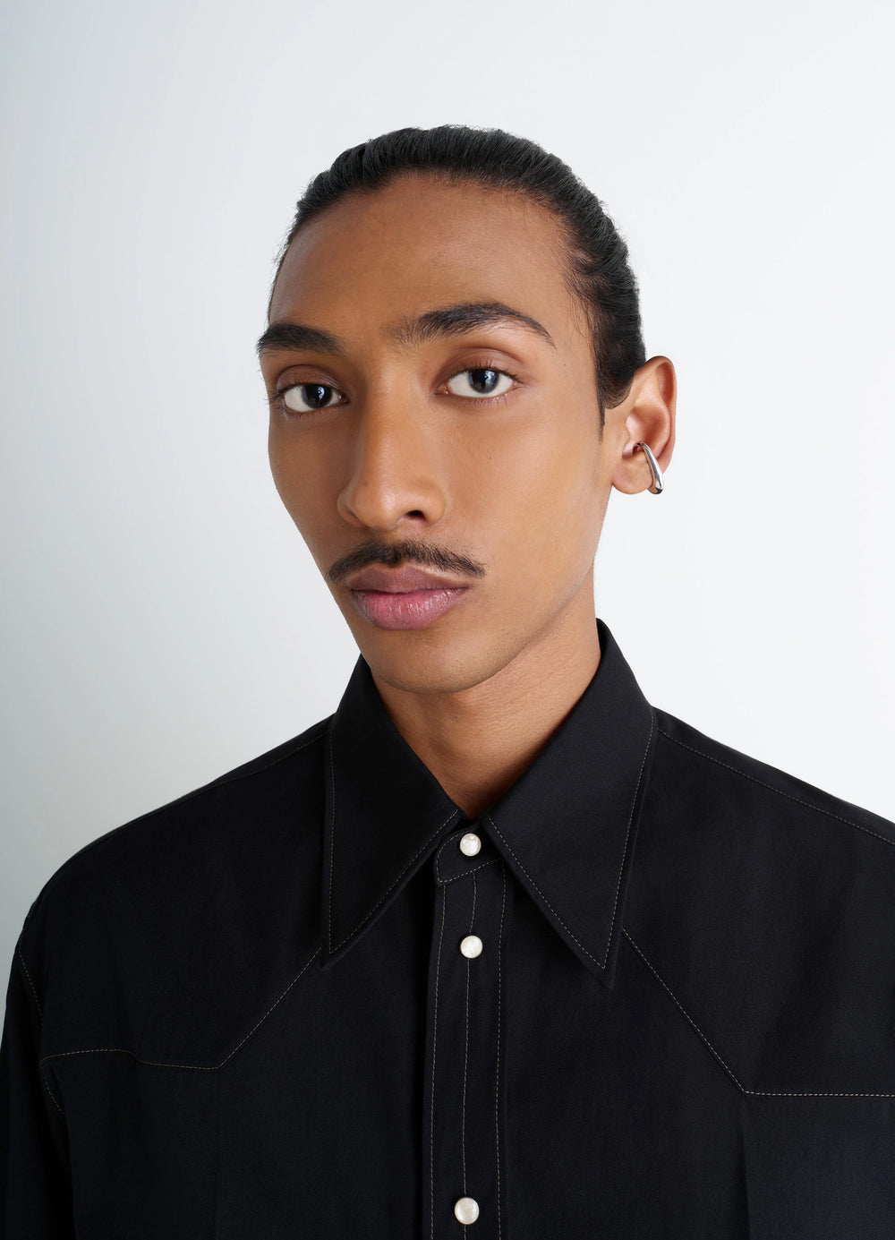 Lemaire Long Drop Earcuff in Rhodium-Plated Silver, model shot, side view worn on left ear