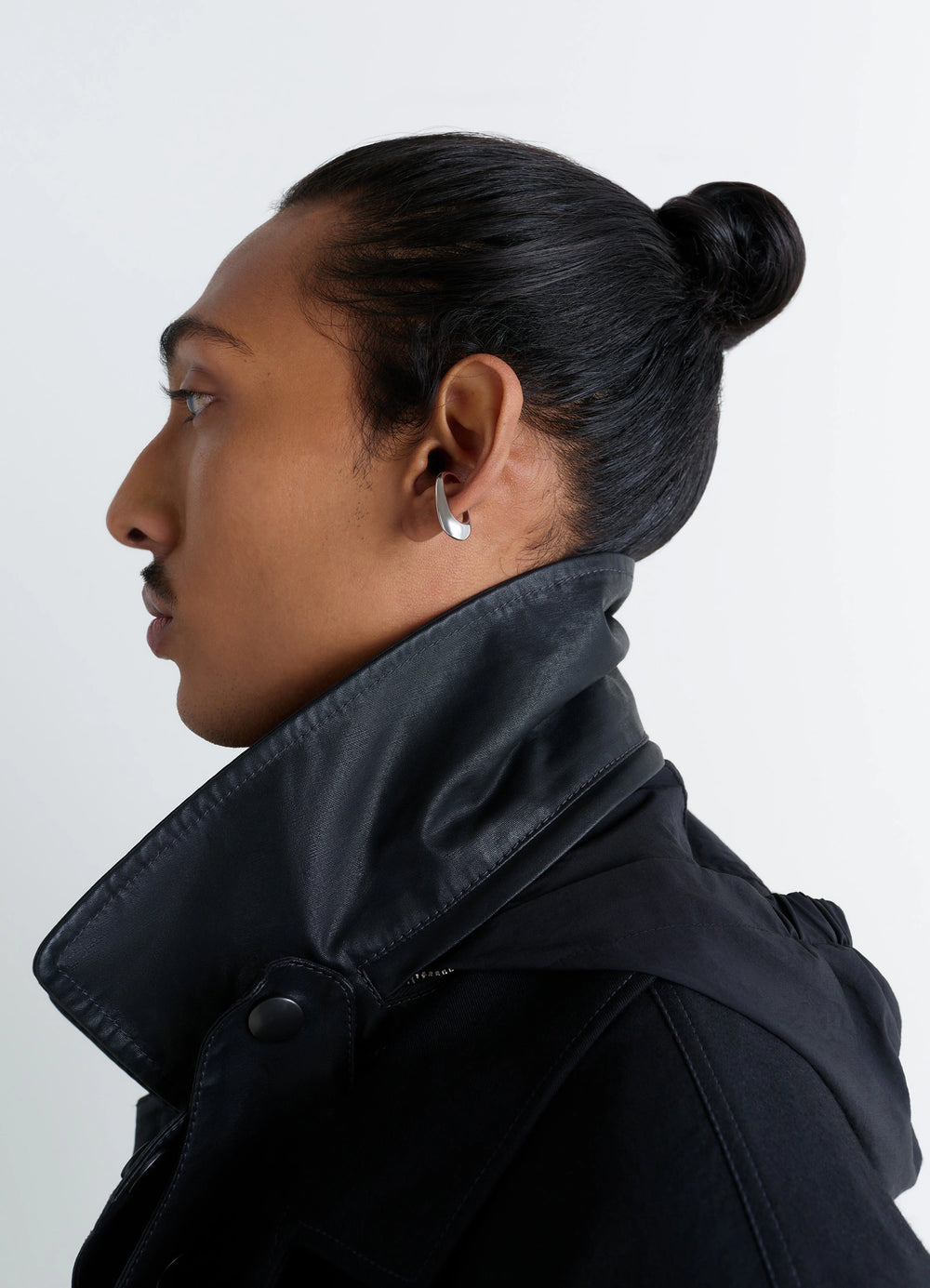 Lemaire Long Drop Earcuff in Rhodium-Plated Silver, model shot, three-quarter view minimalist contour