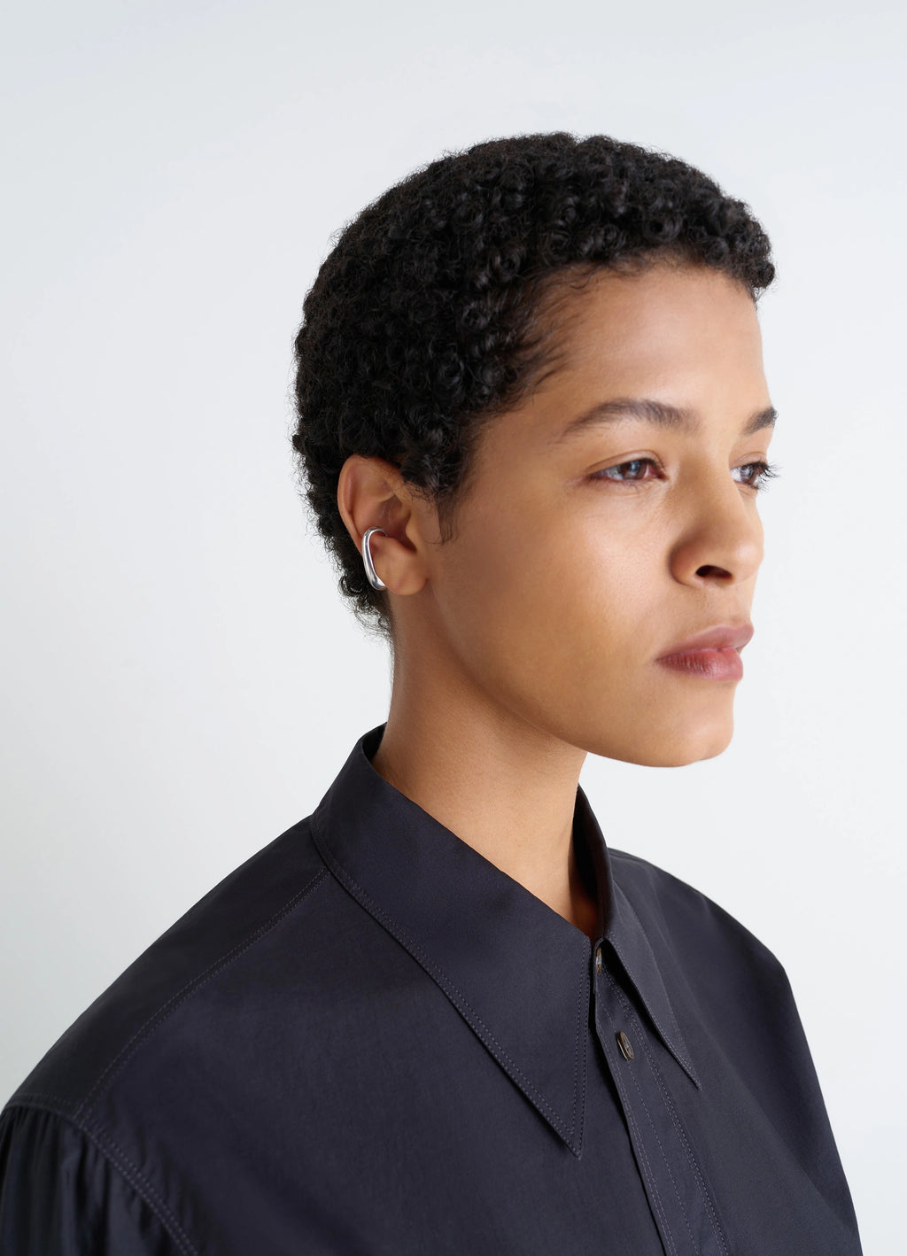 Lemaire Long Drop Earcuff in Rhodium-Plated Silver, model shot, right three-quarter view minimalist on right ear