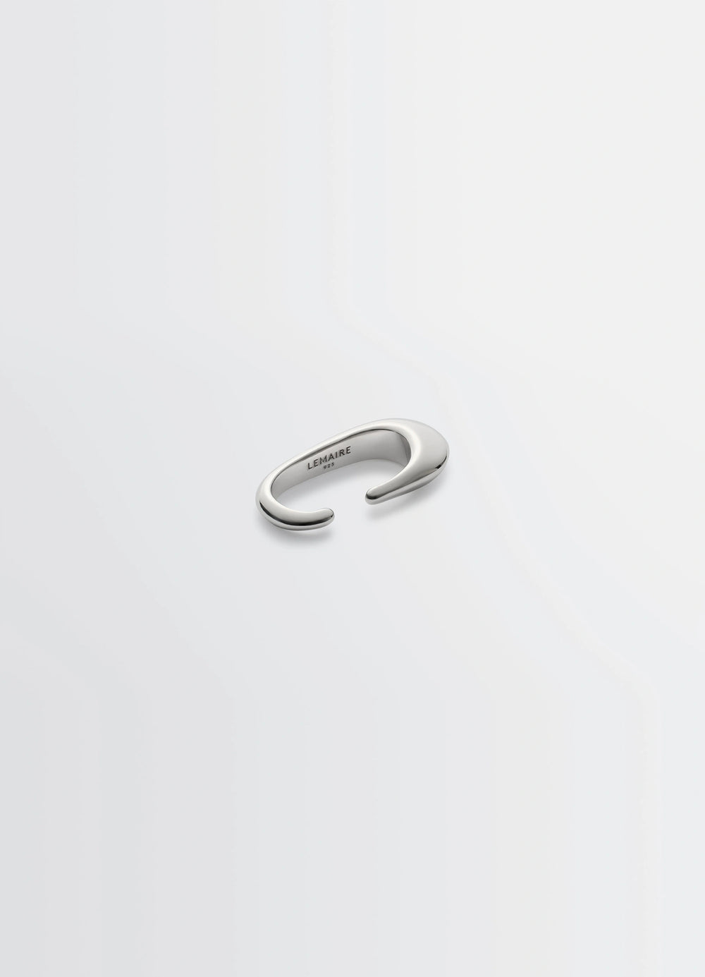 Lemaire Long Drop Earcuff in Rhodium-Plated Silver, product shot, angled top view sleek open-ended curve