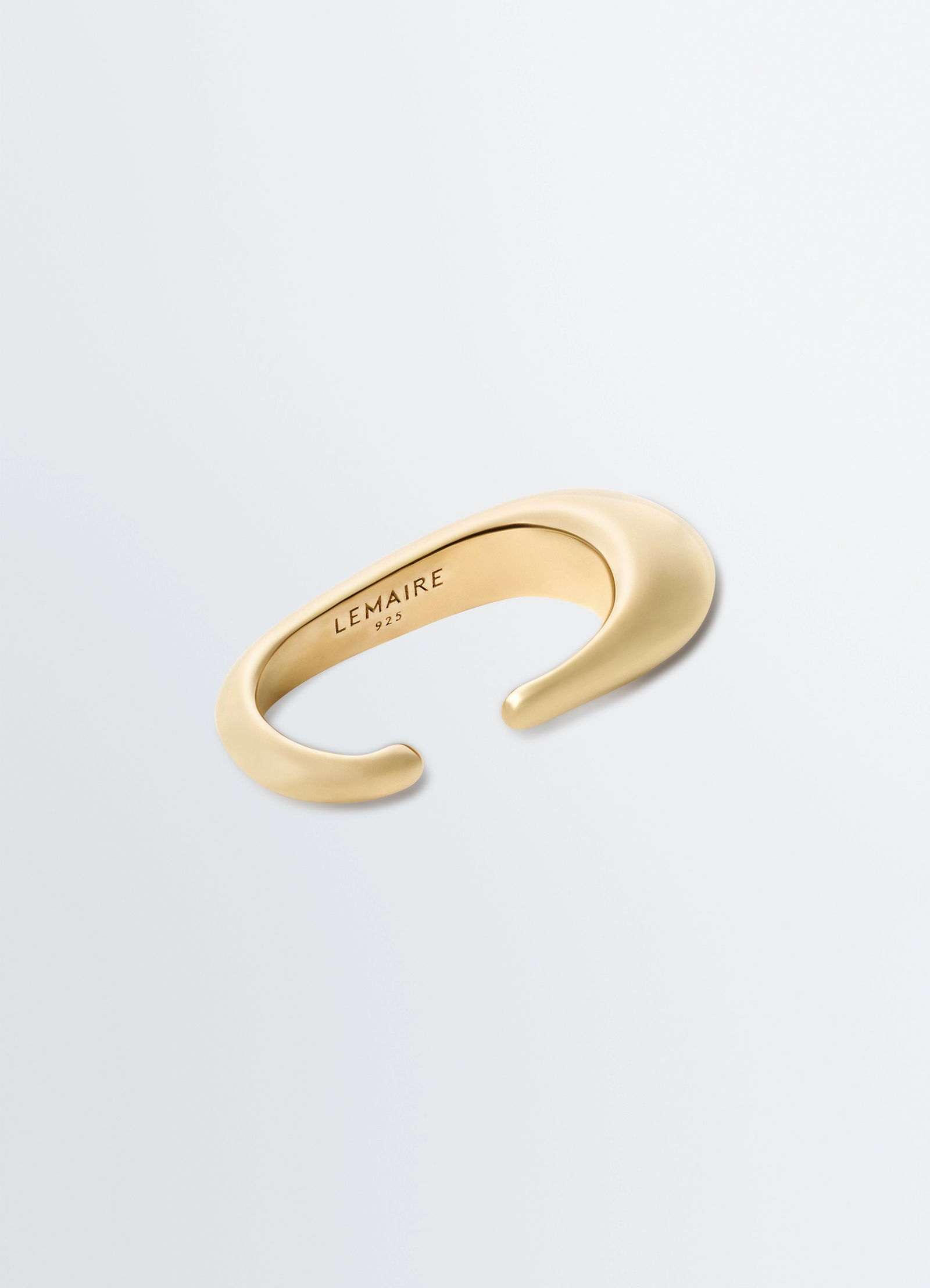Long drop earcuff in vermeil, product shot, angled floating view sleek open-ended curve