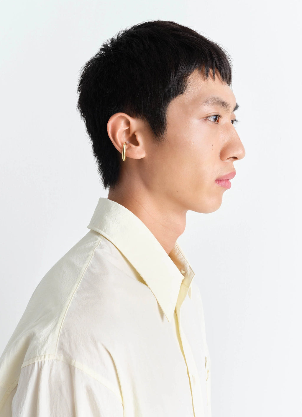 Lemaire Long Drop Earcuff in Vermeil, model shot, side view sleek minimalist design