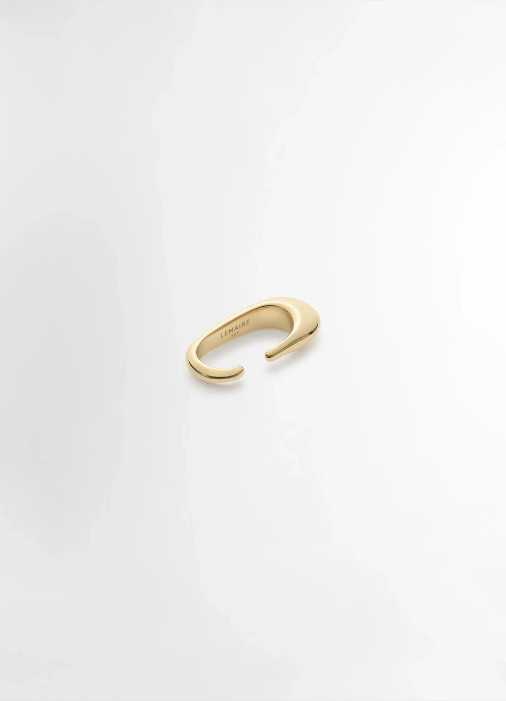 Lemaire Long Drop Earcuff in Vermeil, product shot, top angled view smooth asymmetrical design