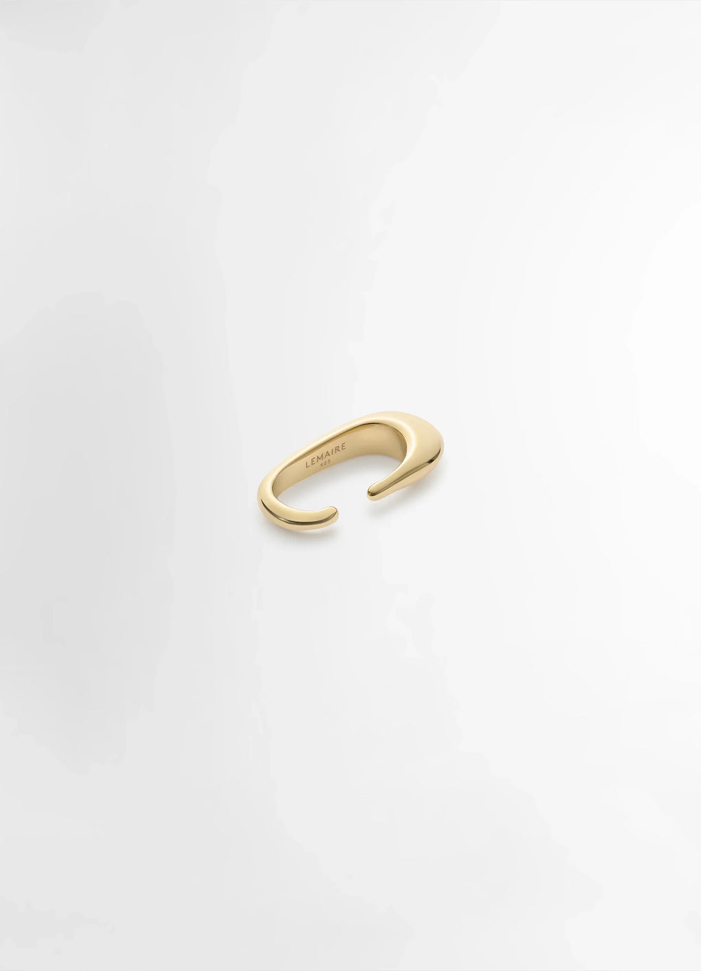 Lemaire Long Drop Earcuff in Vermeil, product shot, top angled view smooth asymmetrical design