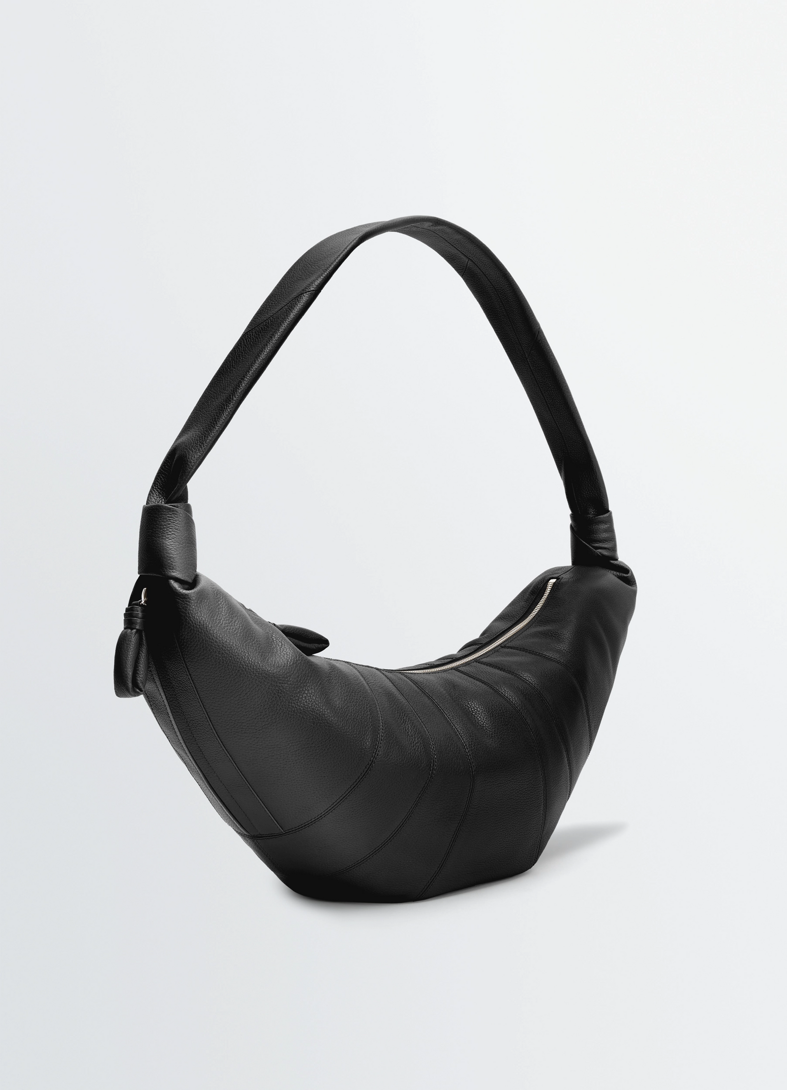 Lemaire large croissant bag in grained leather, product shot, three-quarter front view curved with textured finish