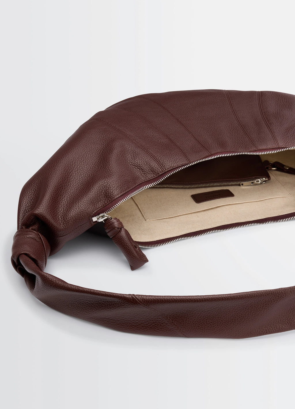 Lemaire Large Croissant Bag in Grained Leather, product shot, top detail view zippered opening