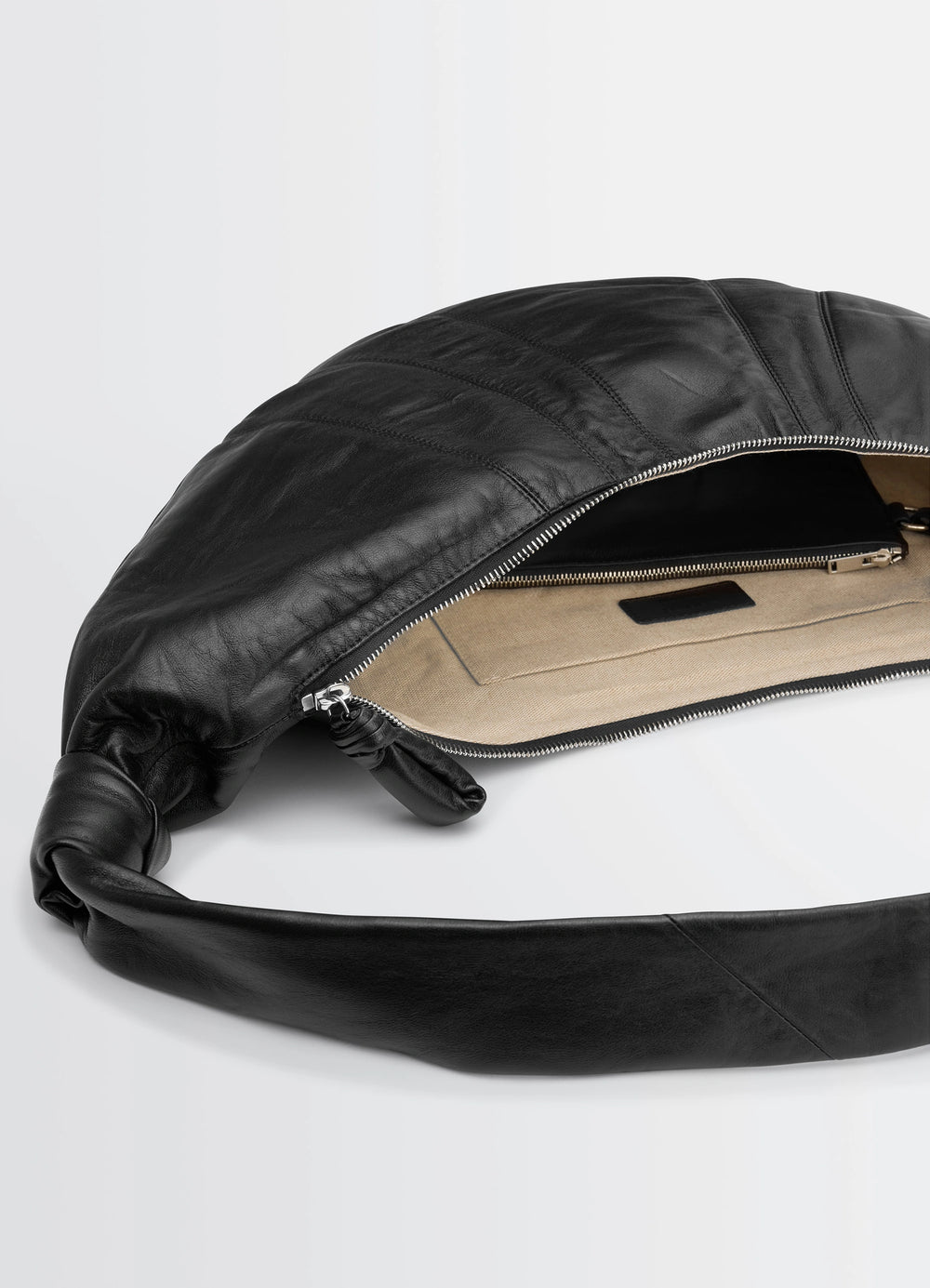 Lemaire Large Croissant Bag in Black Nappa Lamb Leather, product shot, top open view visible interior zipper