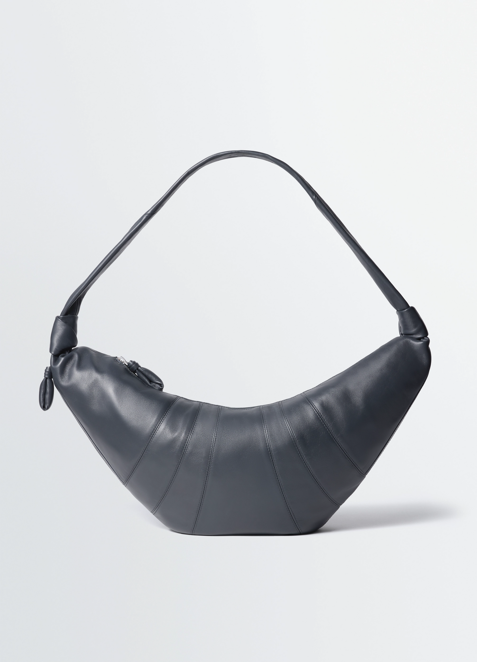 Lemaire large croissant bag in nappa lamb leather, product shot, front view curve with topstitched panels