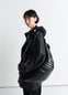 Lemaire Large Croissant Bag in Black Coated Cotton Canvas, model shot, Side view Shiny textured finish