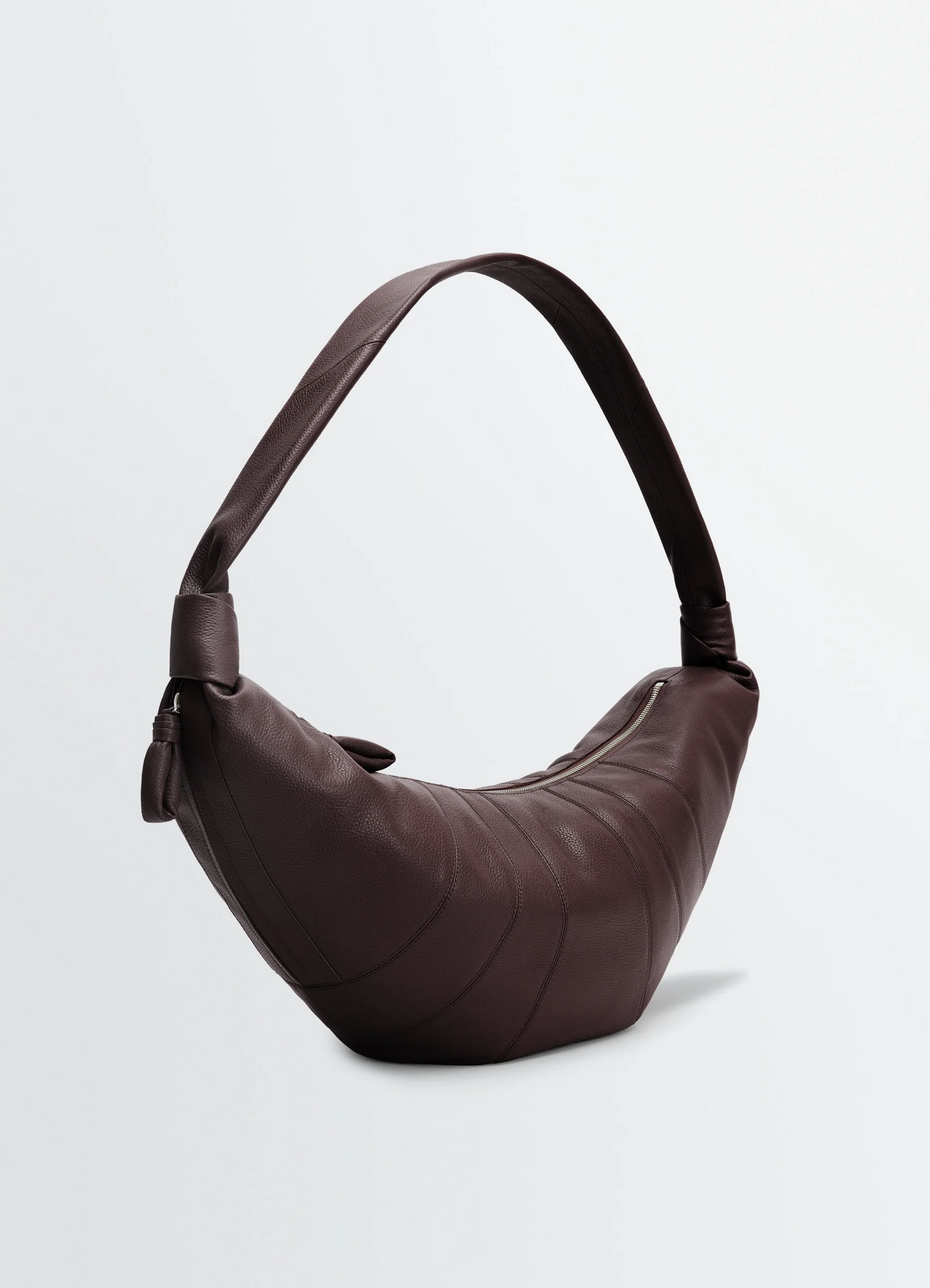 Lemaire large croissant bag in grained leather, product shot, side view textured leather finish