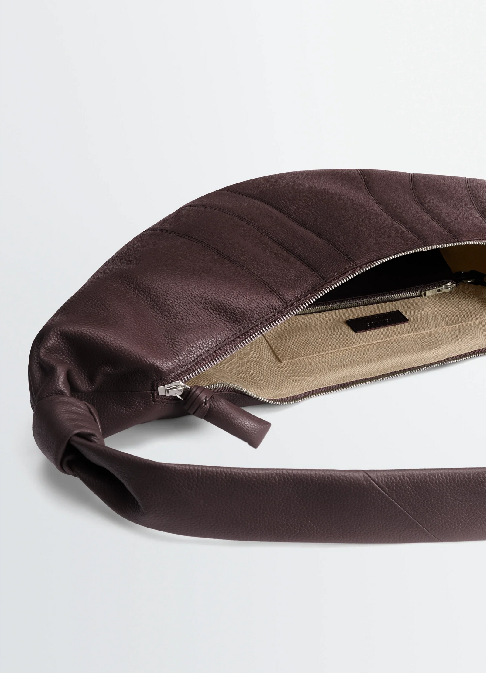 Lemaire large croissant bag in grained leather, product shot, interior view zip closure detail