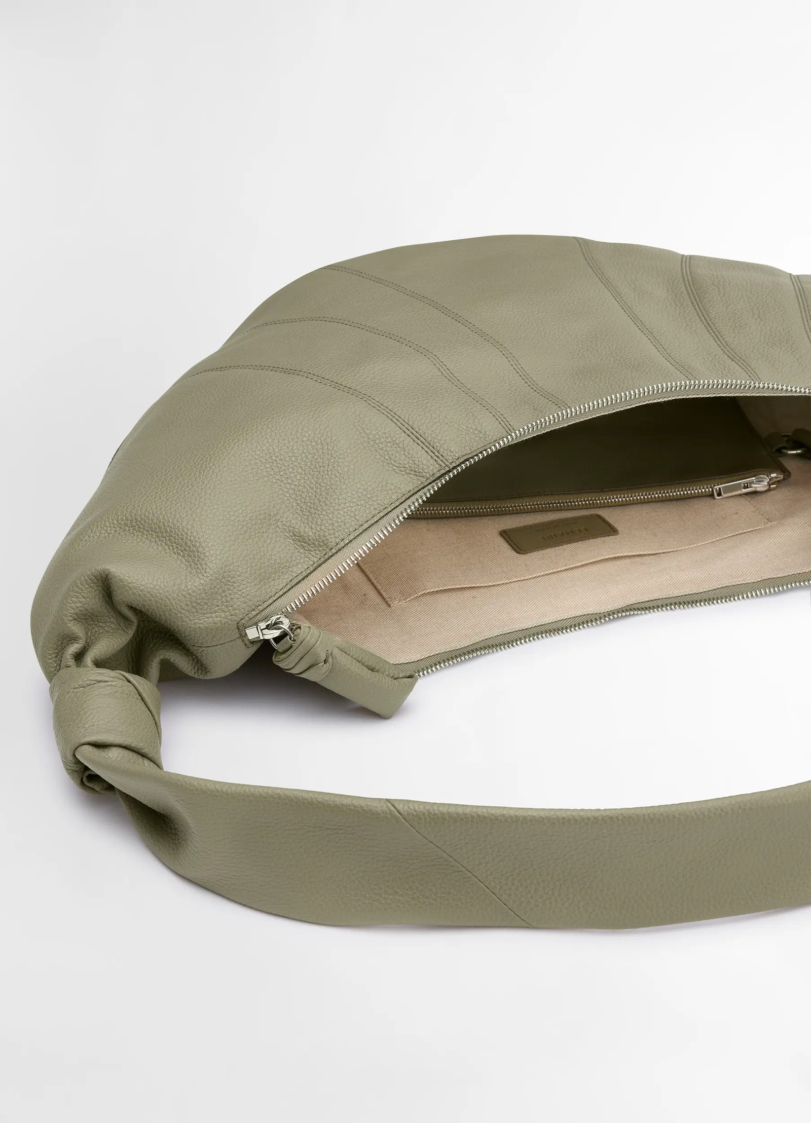 Lemaire large croissant bag in soft grained leather, product shot, top interior view open zipper spacious interior