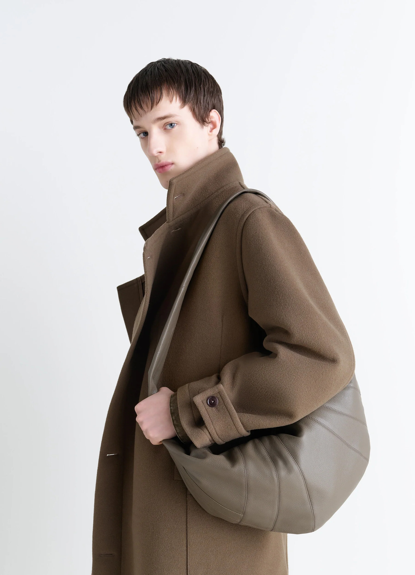 Lemaire large croissant bag in grained leather, model shot, over-the-shoulder view soft rounded texture