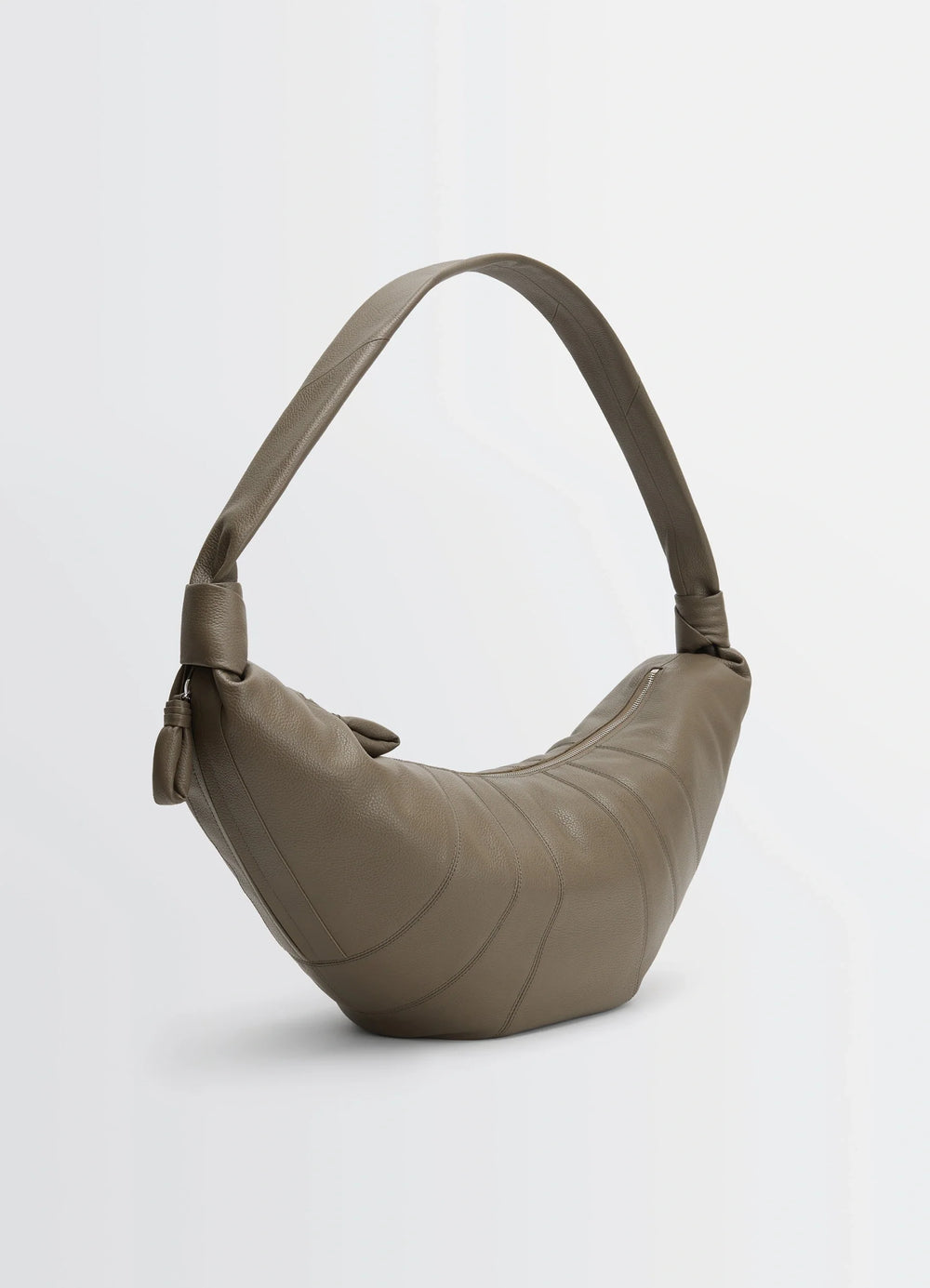 Lemaire Large Croissant Bag in Grained Leather, product shot, three-quarter rear view knot detail on strap
