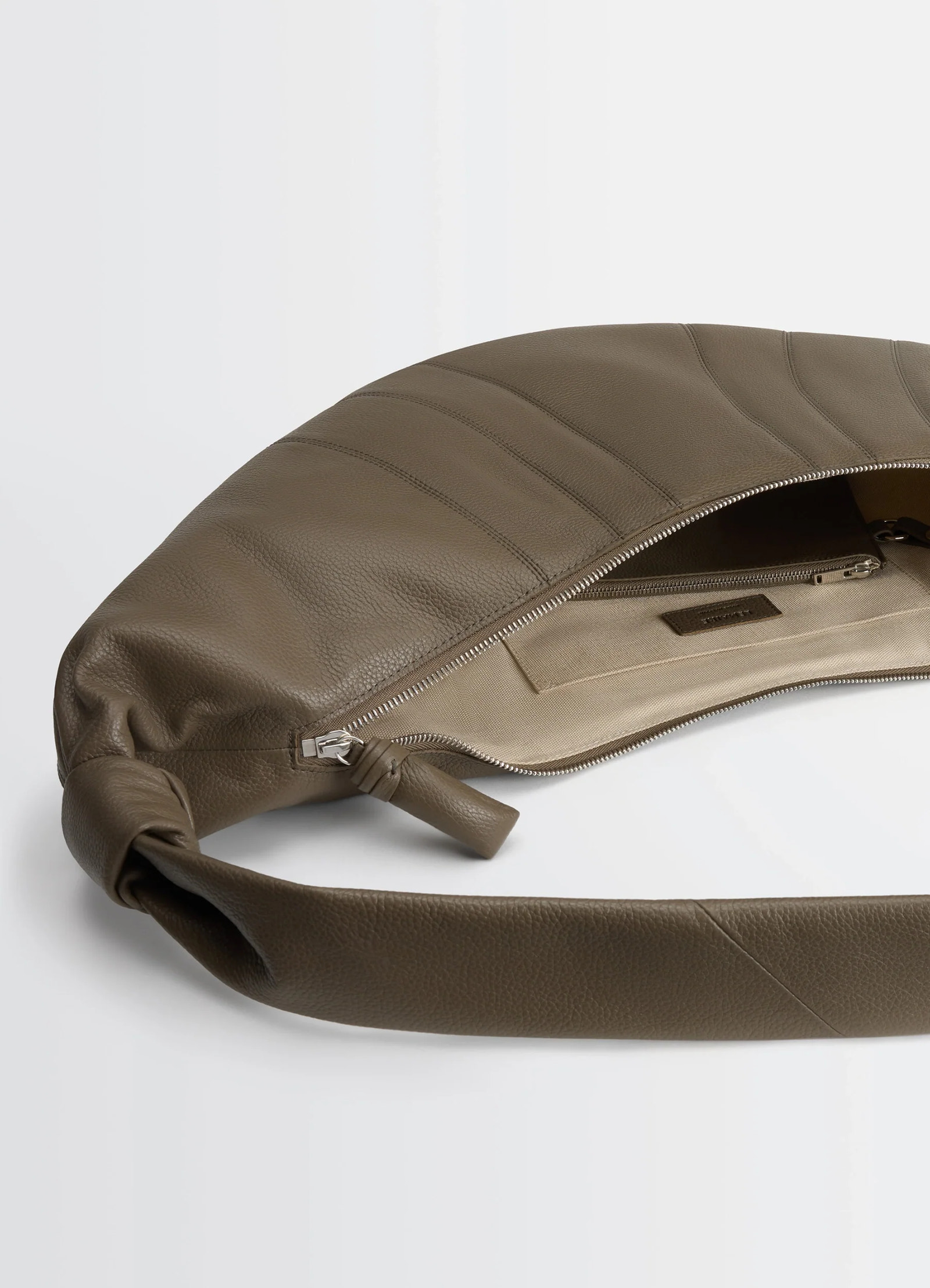 Lemaire large croissant bag in grained leather, product shot, interior view open zipper interior