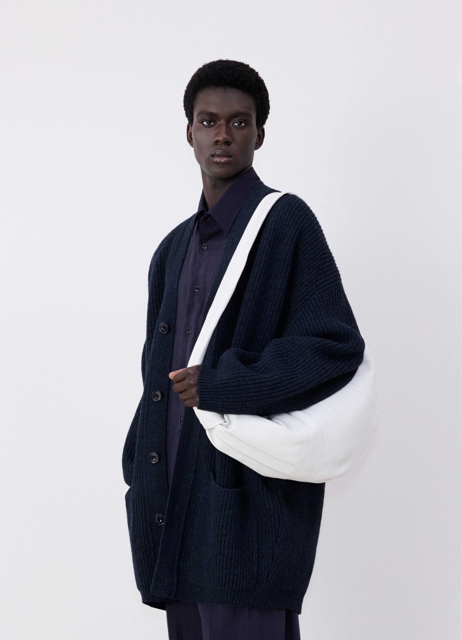 Lemaire large croissant bag in soft grained leather, model shot, over-the-shoulder view slouchy fold detail