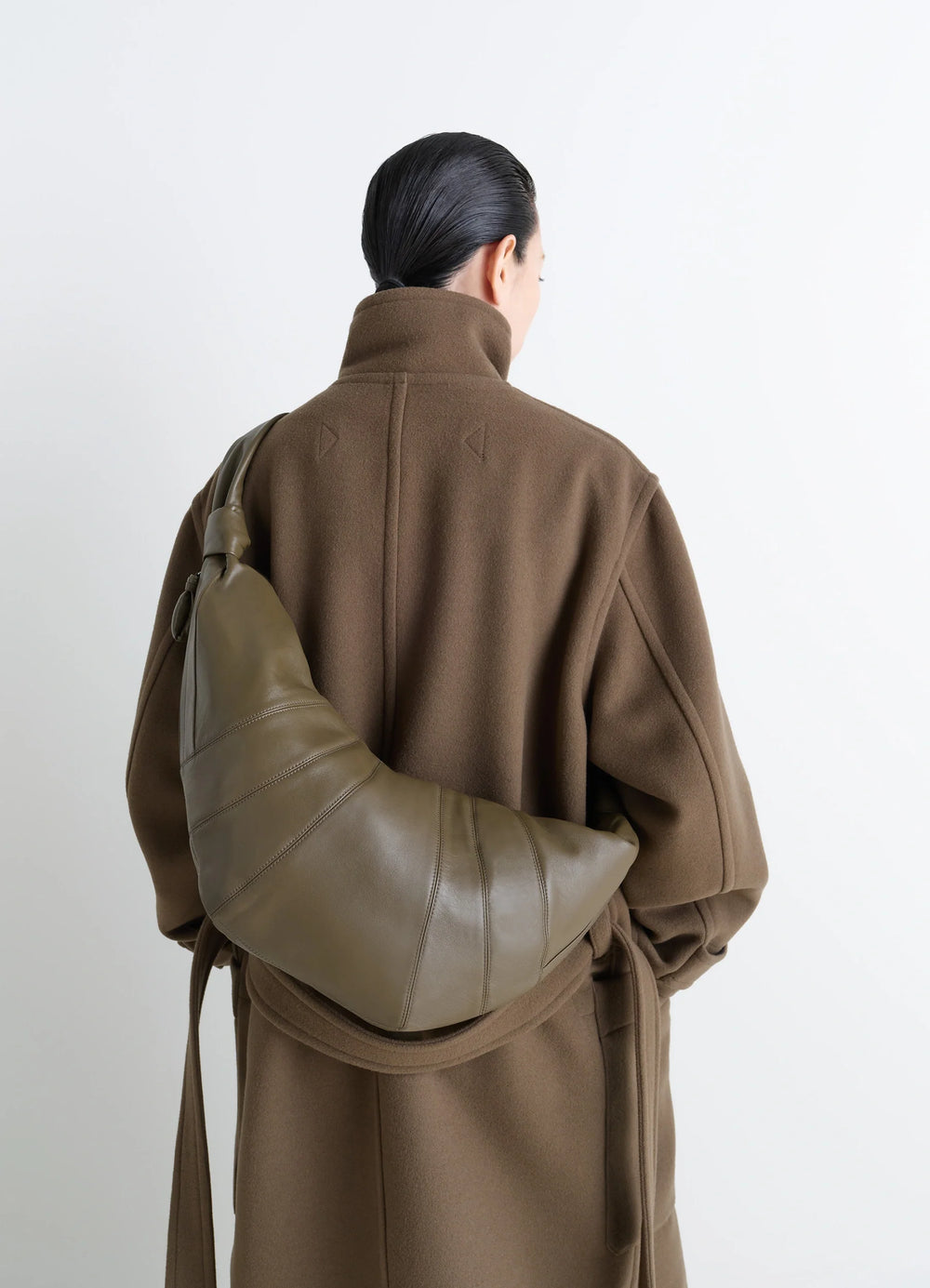 Lemaire Large Croissant Bag in Nappa Lamb Leather, model shot, back view drape over shoulder