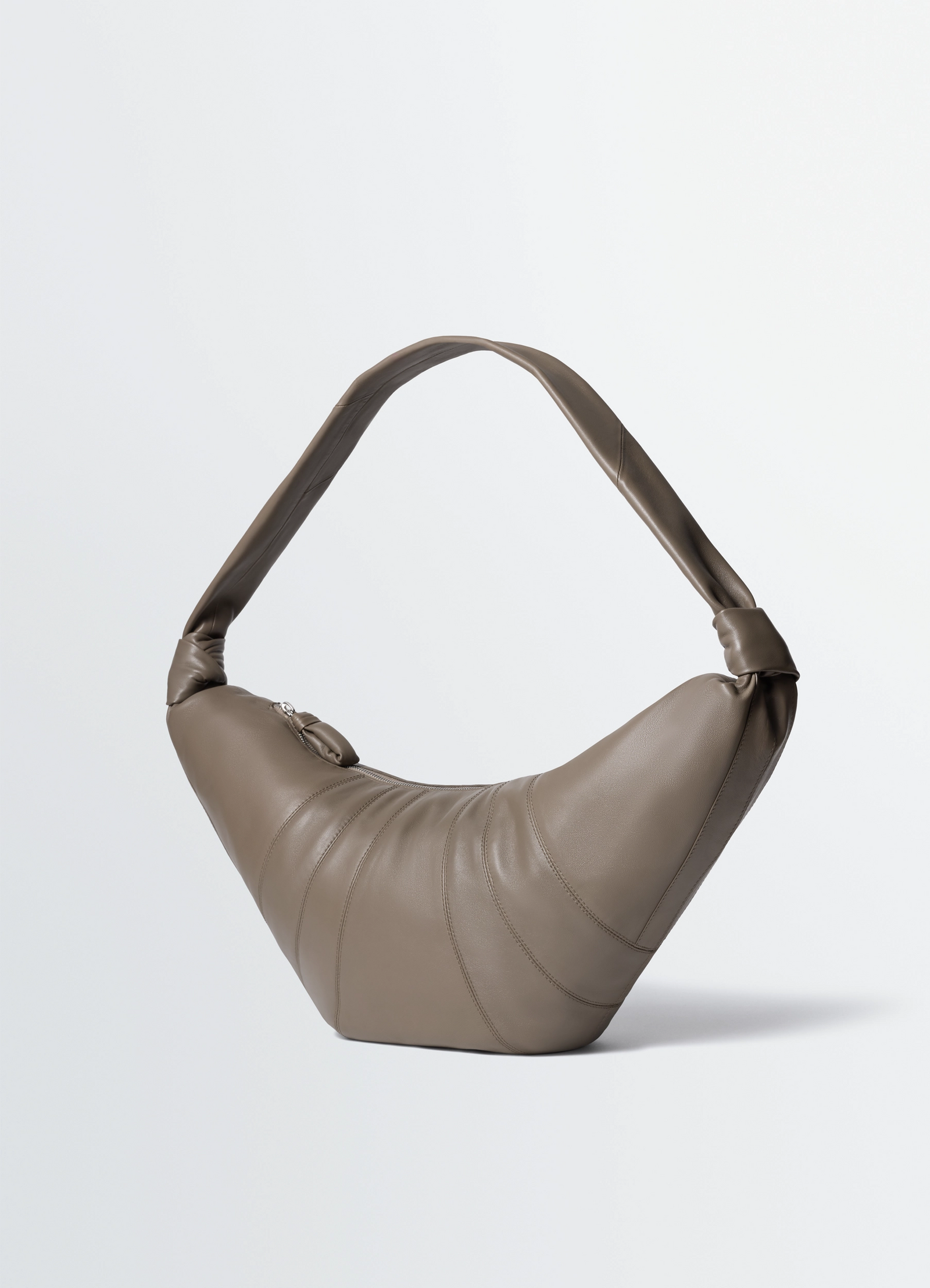 Lemaire large croissant bag in nappa lamb leather, product shot, three-quarter view knotted strap design